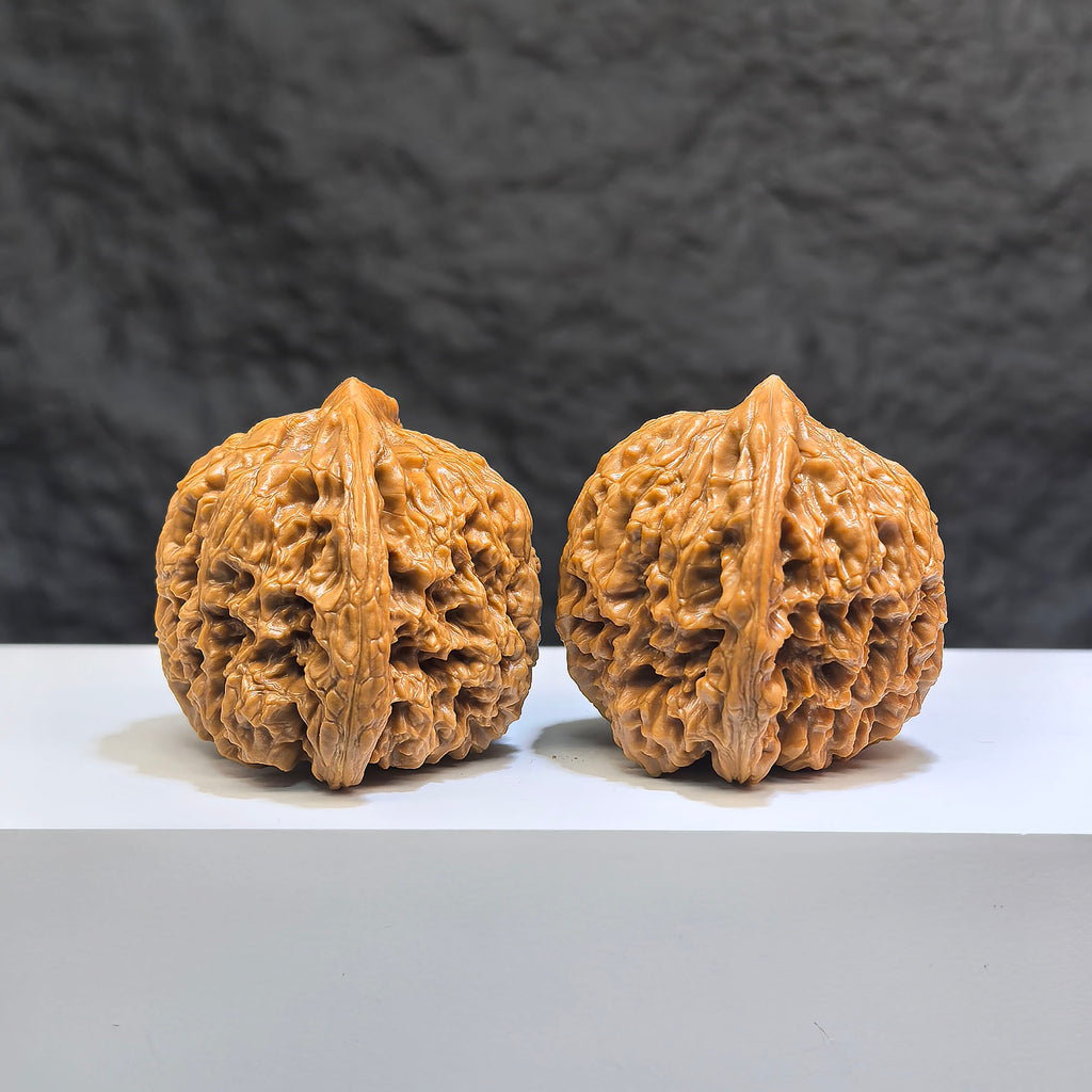 Pair of Classic Scholar Wenwan Walnuts from Wenwan Art, hand-matched with triangular concave base, 42mm size, featuring 南疆石 pattern.