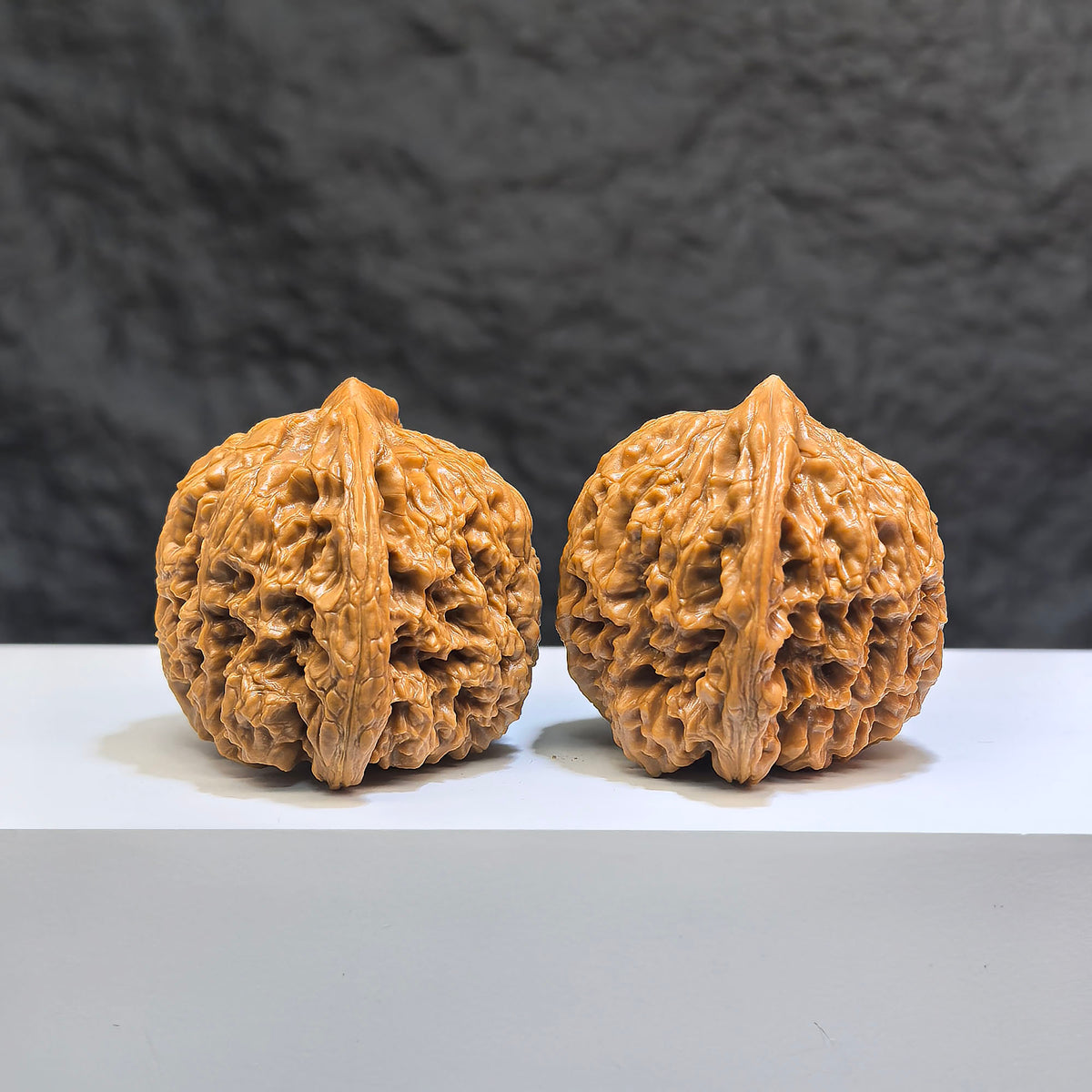 Pair of Classic Scholar Wenwan Walnuts from Wenwan Art, hand-matched with triangular concave base, 42mm size, featuring 南疆石 pattern.