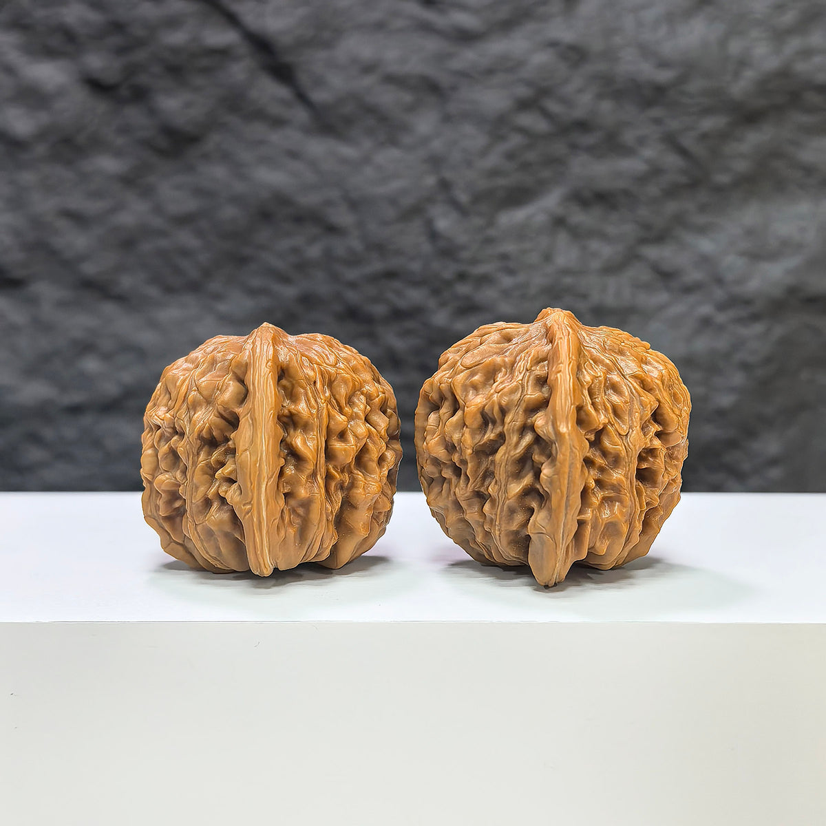Pair of Sizuolou Wenwan Walnuts from Wenwan Art, 41mm x 37mm, showcasing intricate natural walnut carvings and rich texture.