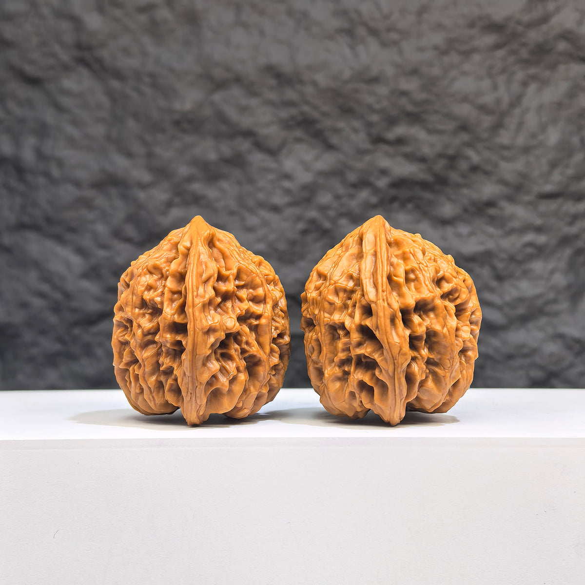 Selected grade Wenwan Art small bison walnut, 3.5x3.3cm, featuring smooth texture and natural wood grain details.