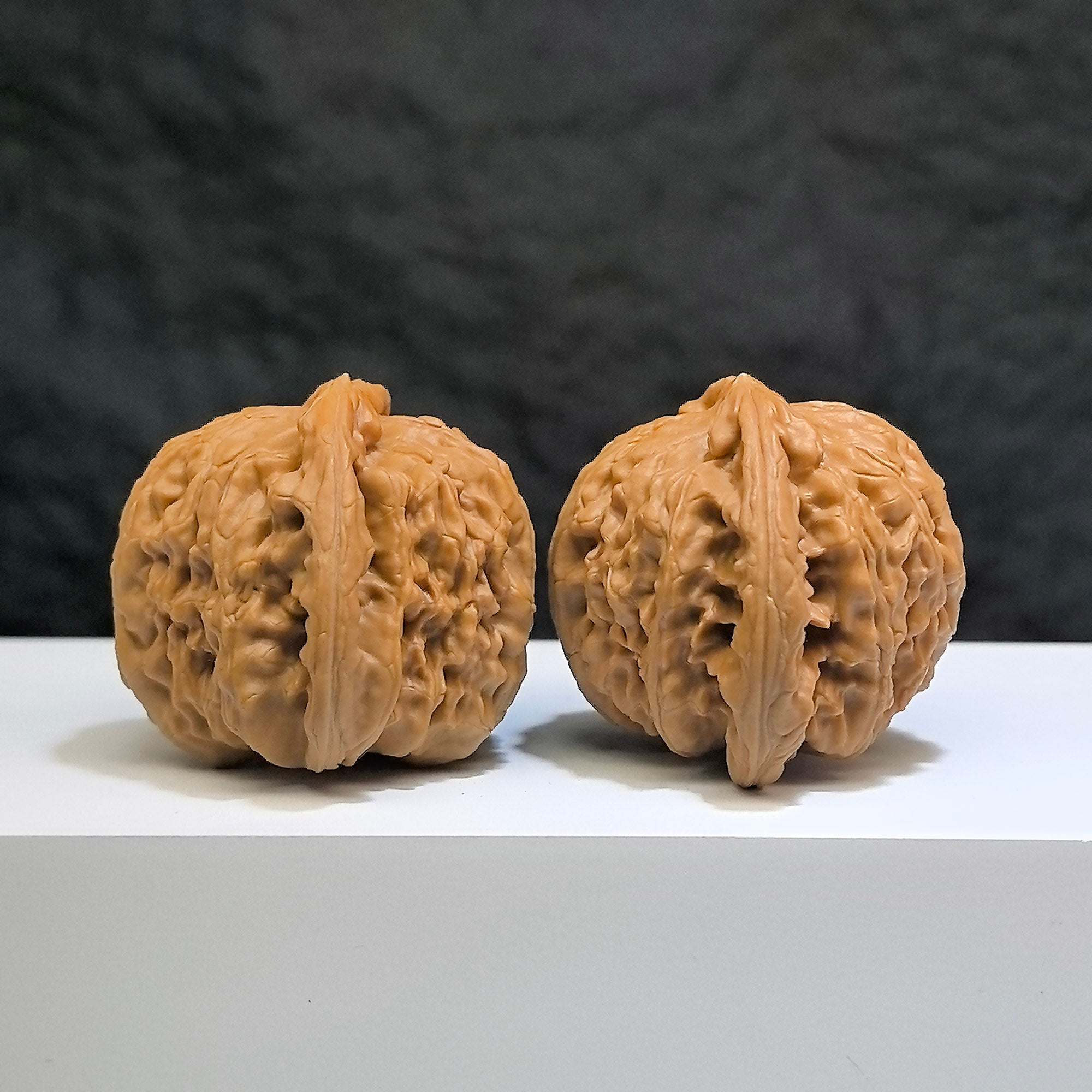 Pair of White Lion Wenwan Walnuts by Wenwan Art, classic 41mm and 38mm size, featuring intricate white lion carvings.