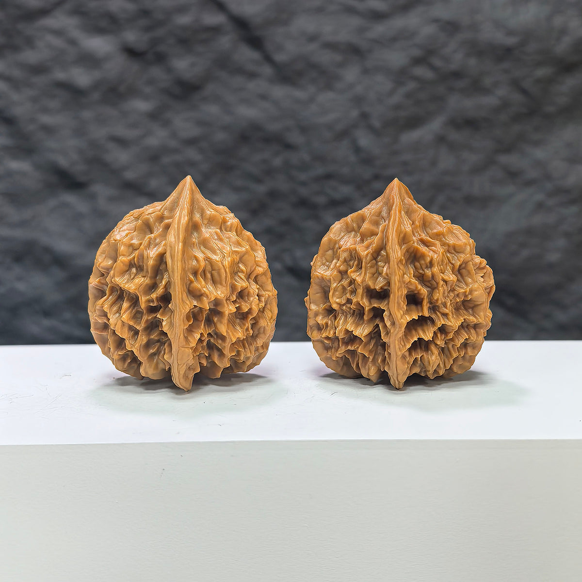 Pair of Dragon Scale Wenwan Walnuts by Wenwan Art, 36mm each, featuring intricate natural carvings and detailed textures.