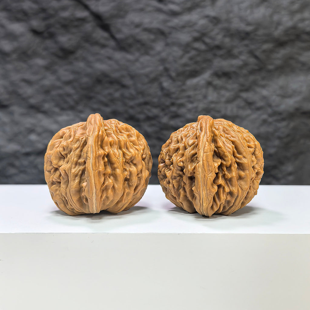 Pair of Sizuolou Wenwan walnuts by Wenwan Art, 41mm x 39mm, showcasing smooth, polished walnut carvings with natural wood grain.