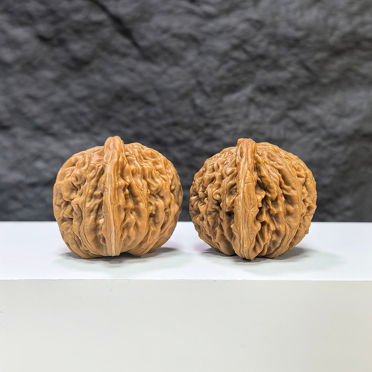 Pair of Sizuolou Wenwan walnuts by Wenwan Art, 41mm x 39mm, showcasing smooth, polished walnut carvings with natural wood grain.