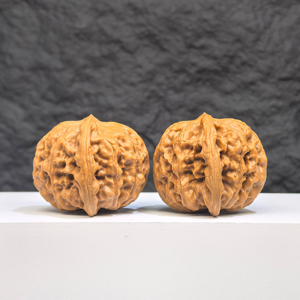 Authentic Wild Wenwan Walnut pair from Wenwan Art, wild wolf design, 37x39mm, detailed natural wood grain, collectible Wenwan art pieces.