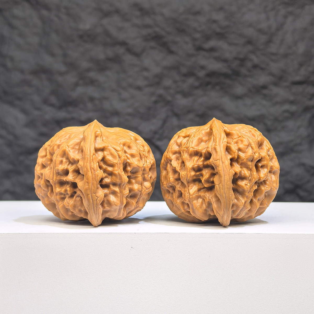 Authentic Wild Wenwan Walnut pair from Wenwan Art, wild wolf design, 37x39mm, detailed natural wood grain, collectible Wenwan art pieces.