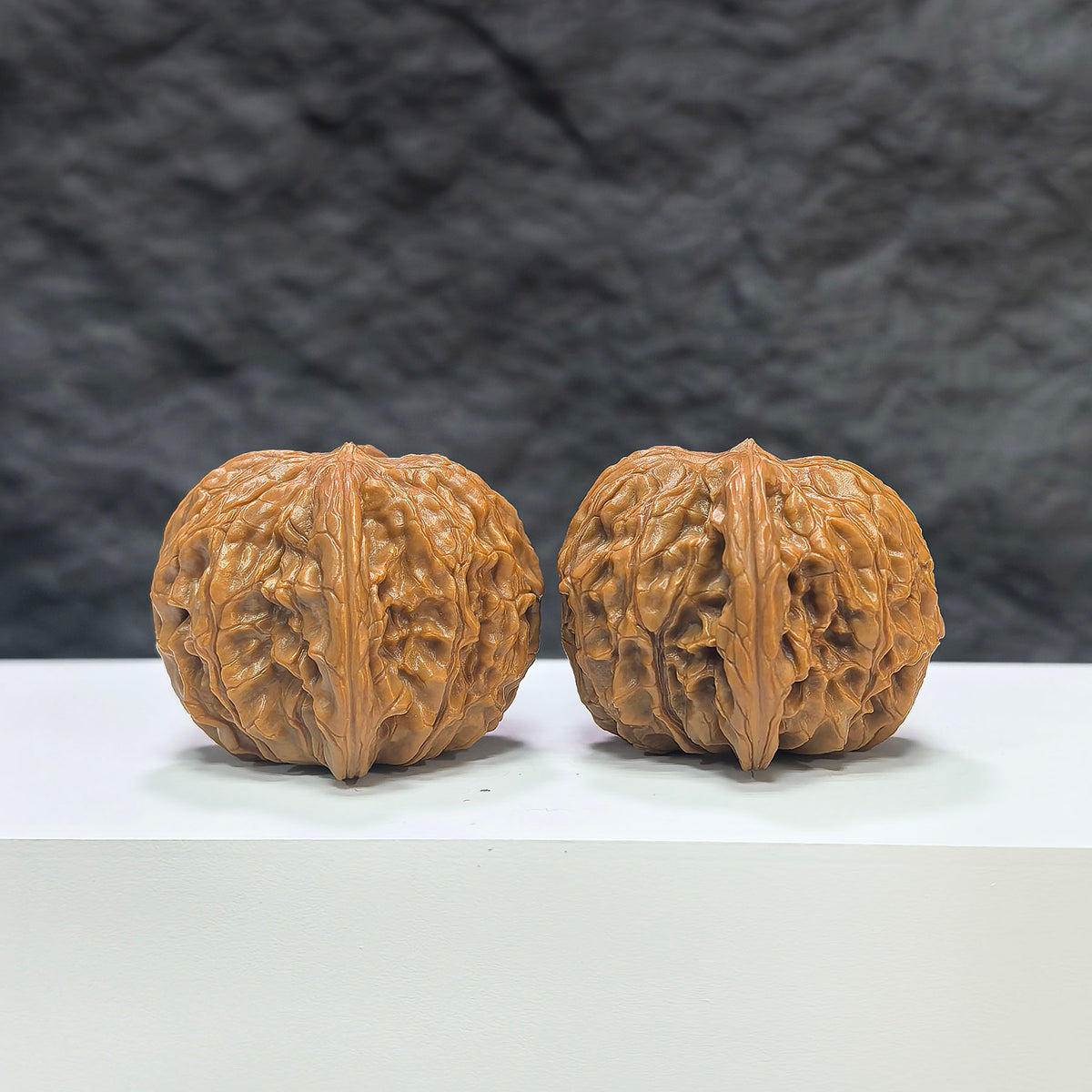 Pair of Classic Scholar Wenwan Walnuts by Wenwan Art, hand-matched, 41mm x 39mm, showcasing detailed craftsmanship and natural walnut patterns.