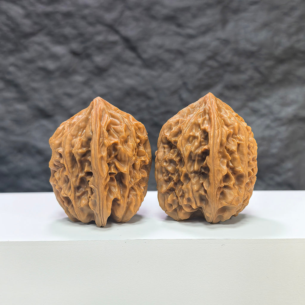 Pair of Beijing Chicken Heart Wenwan walnuts from Wenwan Art, measuring 41mm x 40mm, showcasing smooth, natural walnut surfaces.