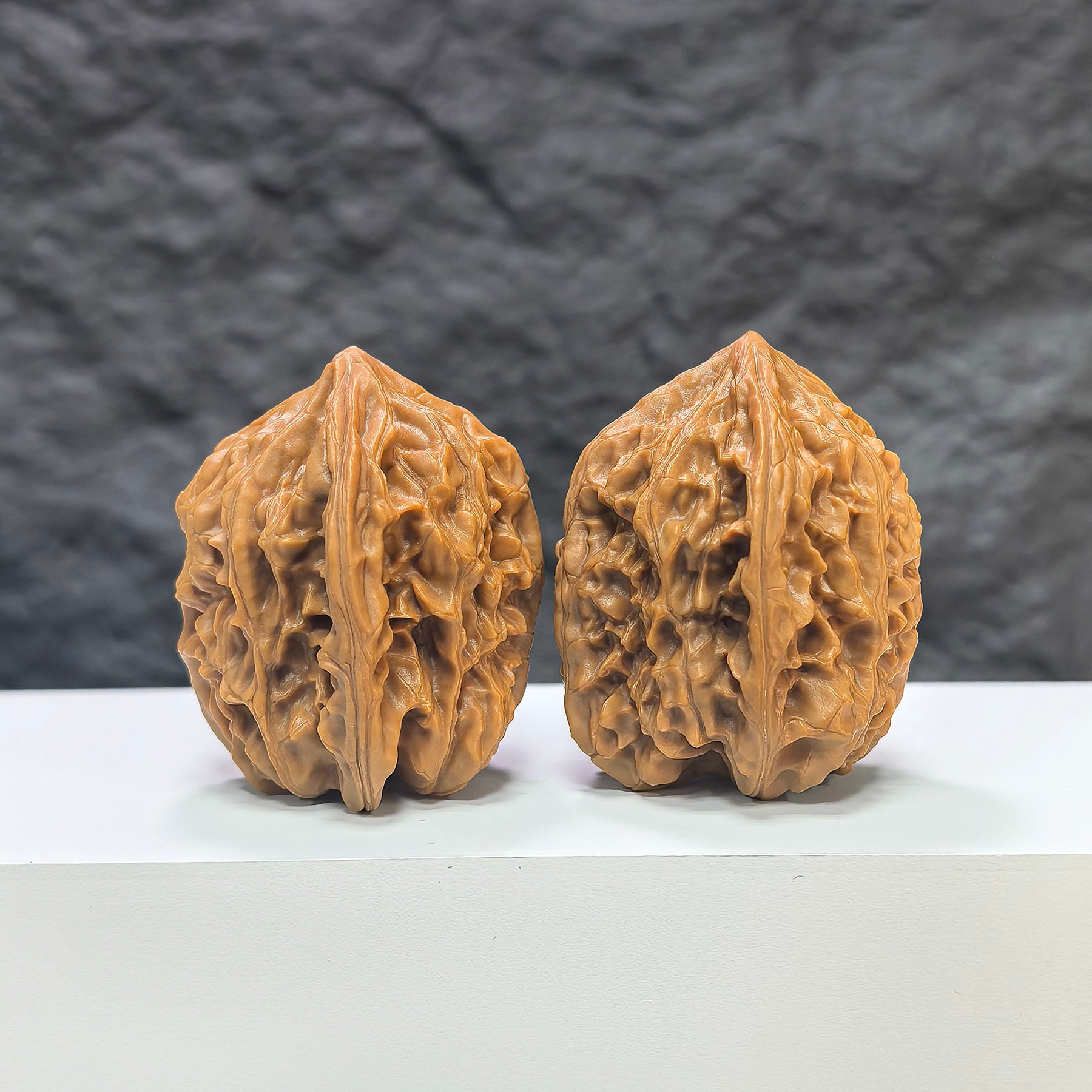 Pair of Beijing Chicken Heart Wenwan walnuts from Wenwan Art, measuring 41mm x 40mm, showcasing smooth, natural walnut surfaces.