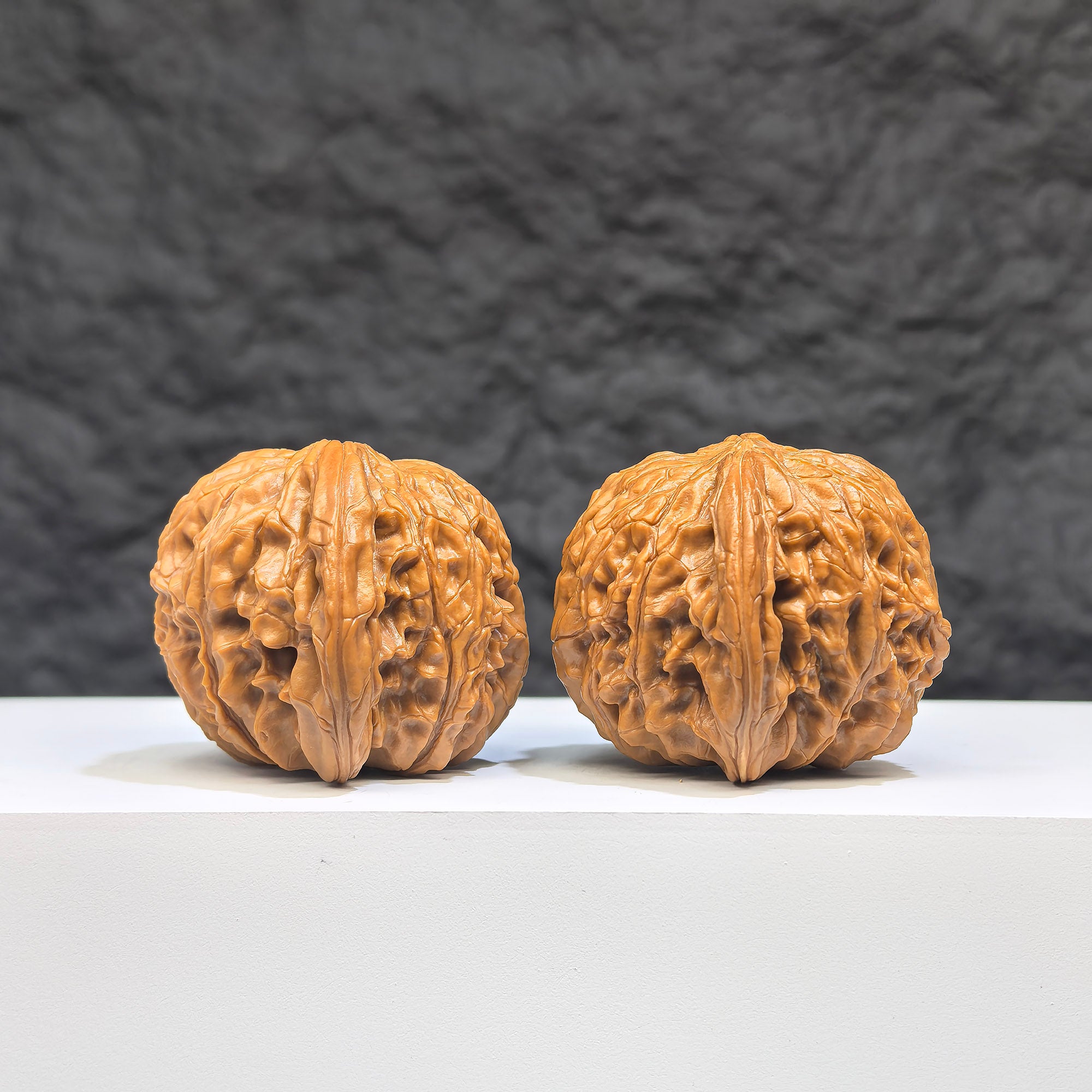 Pair of red shell Wenwan walnuts from Wenwan Art, 42mm x 38mm, featuring classic millstone design and vibrant red shell.