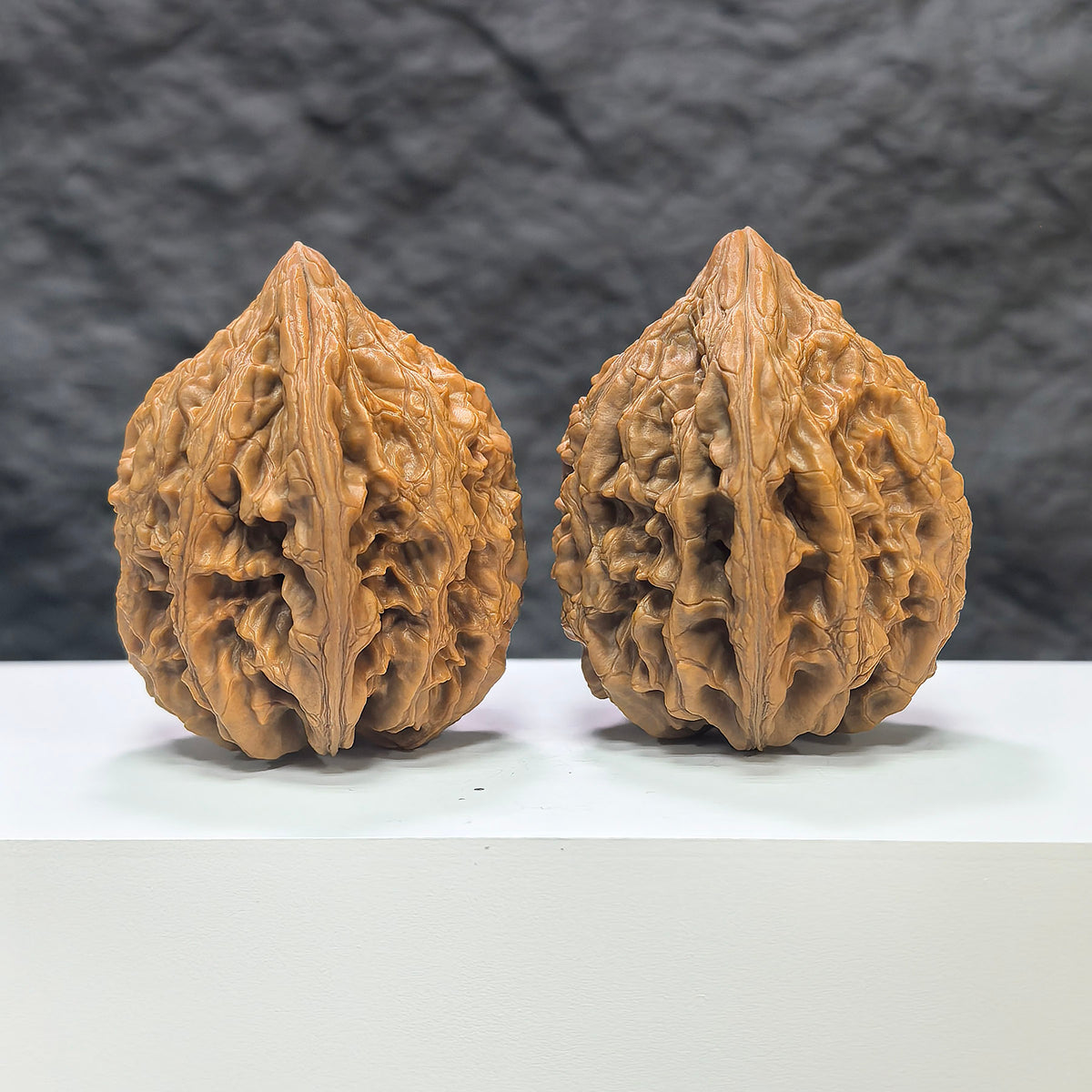 Pair of Classic Scholar Wenwan Walnuts by Wenwan Art, hand-matched with 42mm and 43mm sizes, showcasing polished, natural walnut surfaces.