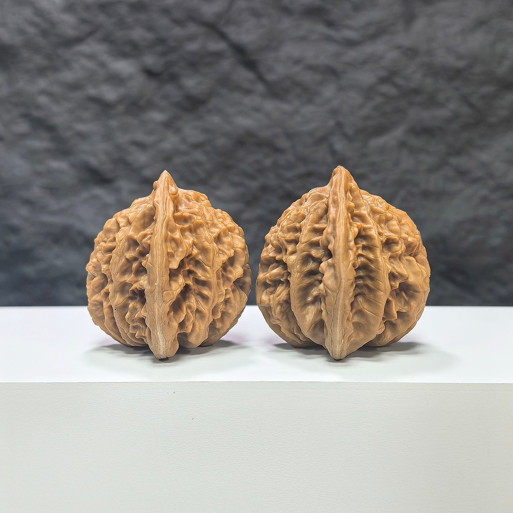 Wenwan Art Xiayunling classic Wenwan walnut pair, 43mm x 41mm, displaying smooth, polished walnut carvings with natural wood grain.
