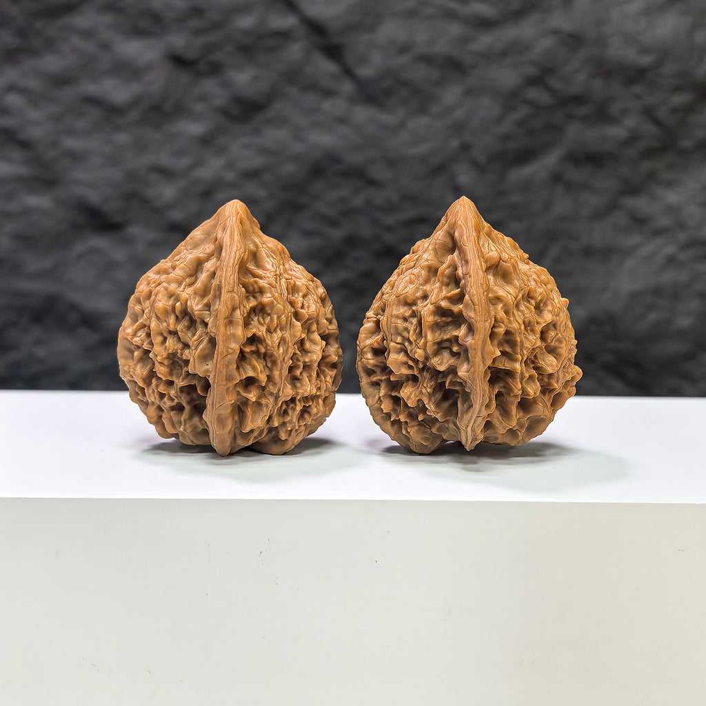 Golden Kylin Wenwan Walnut pair by Wenwan Art, 36mm x 37mm, showcasing intricate carvings and rich golden color.
