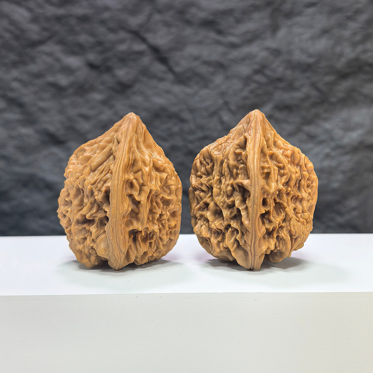 Pair of Beijing Chicken Heart Wenwan walnuts by Wenwan Art, 41mm size, showcasing smooth, polished natural walnut surfaces.