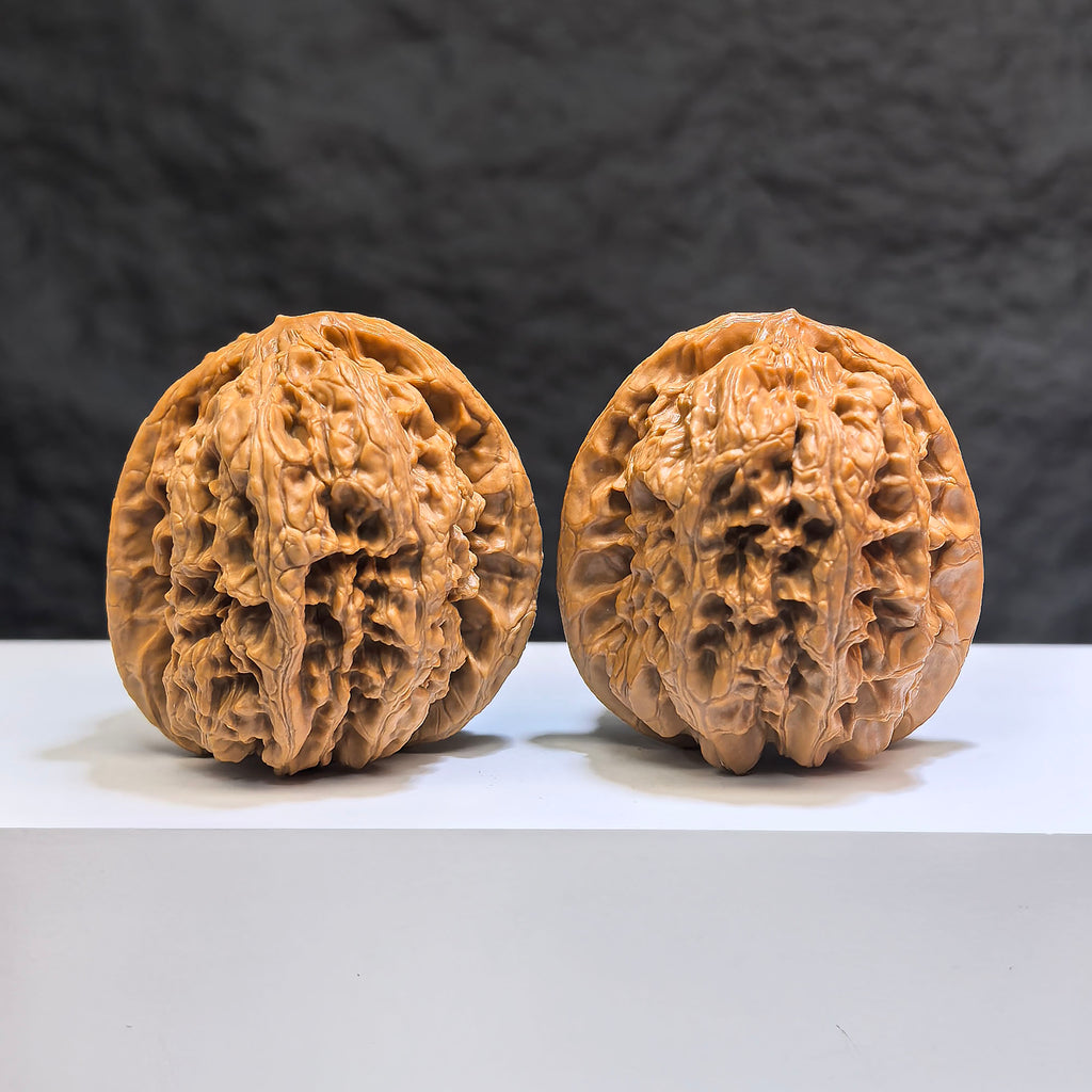 Hand-matched Wenwan Scholar Walnut pair from Wenwan Art, 44mm x 42mm, featuring intricate natural wood grain patterns.