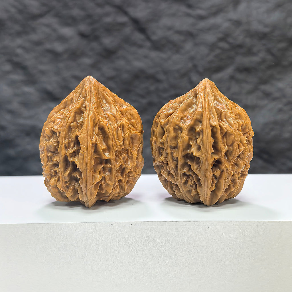 Pair of Beijing Chicken Heart Wenwan walnuts from Wenwan Art, 39mm size, with detailed natural walnut textures and rich color.