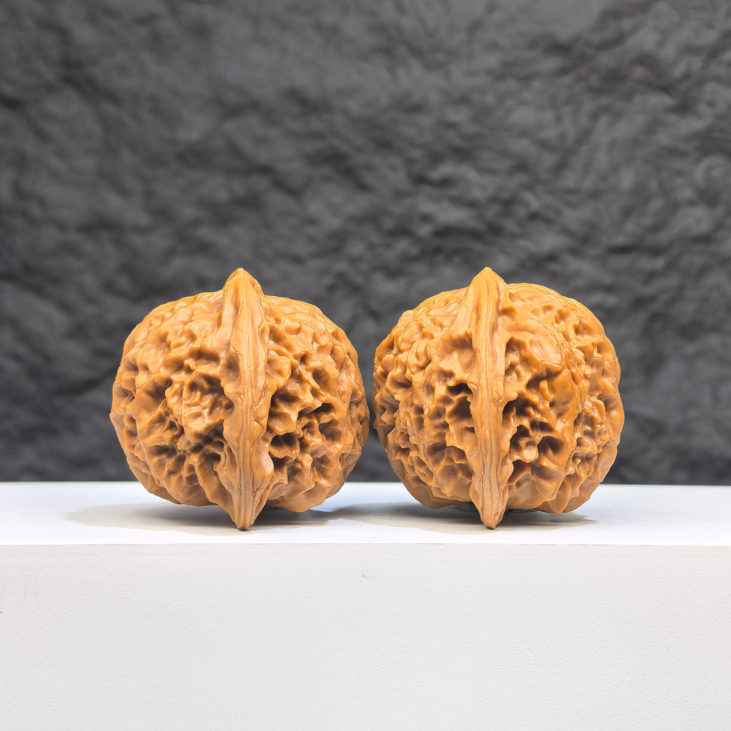 Pair of Peach Heart Palace Lantern Wenwan walnuts from Wenwan Art, featuring intricate peach heart designs, 42mm x 38mm size.