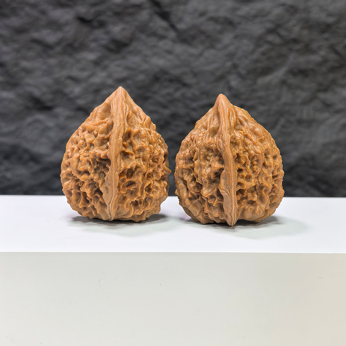 Pair of Golden Kylin Wenwan walnuts by Wenwan Art, classic 37mm x 36mm walnut carvings with intricate golden details.