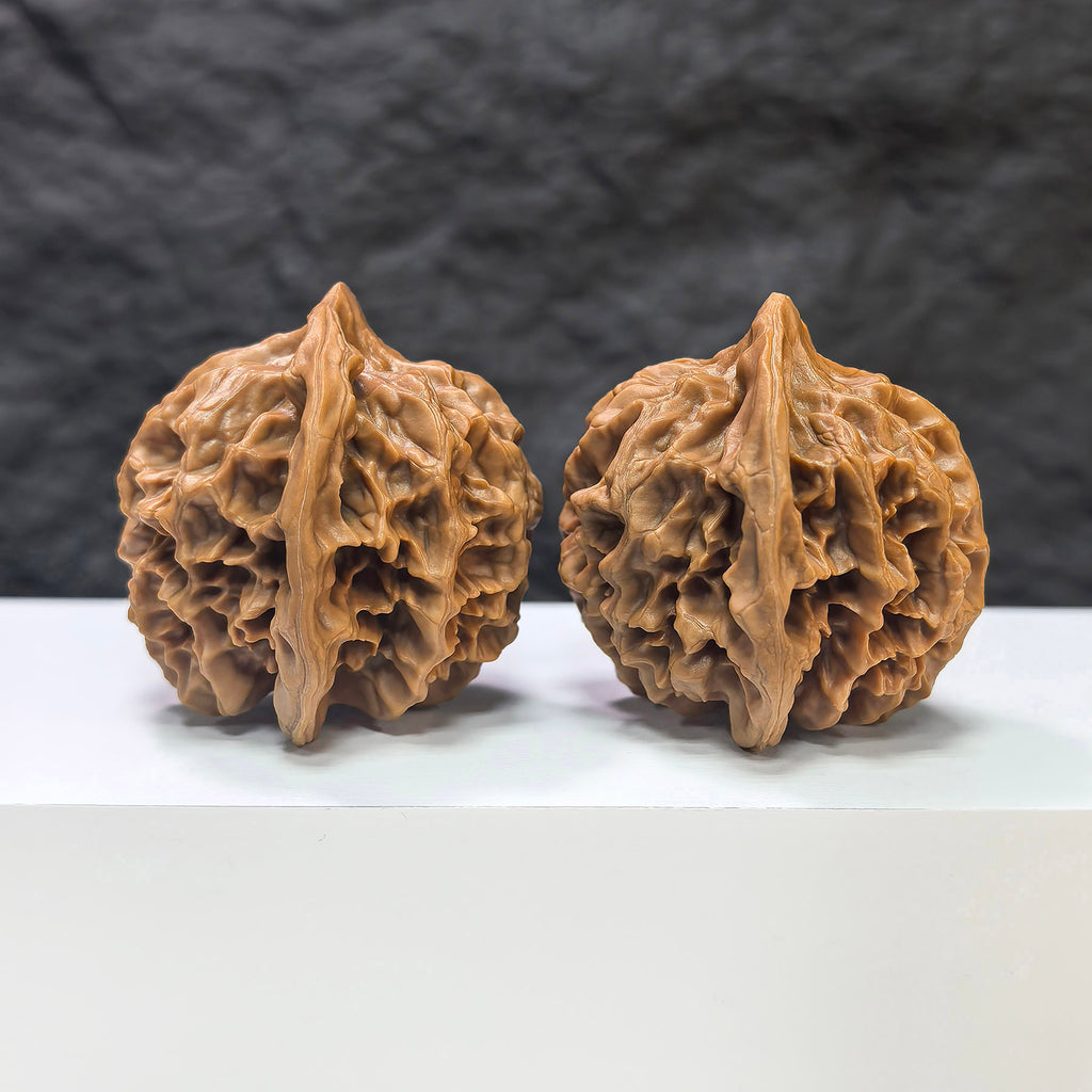 Pair of Emperor Wenwan Walnuts from Wenwan Art, 43mm x 42mm, showcasing smooth, polished surfaces with natural wood grain details.