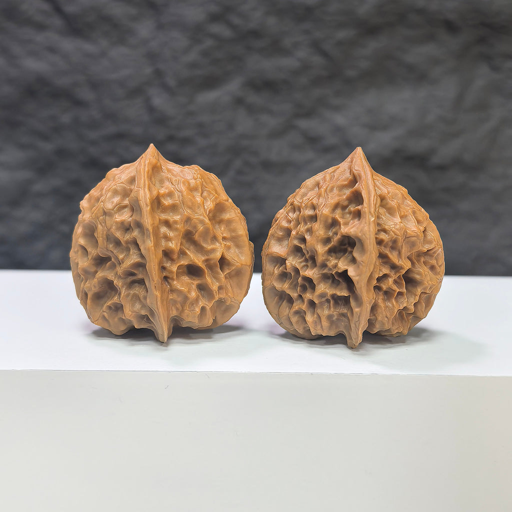 Pair of Linglong x White Snake Valley Wenwan walnuts by Wenwan Art, 33mm x 35mm, featuring intricate natural walnut textures.