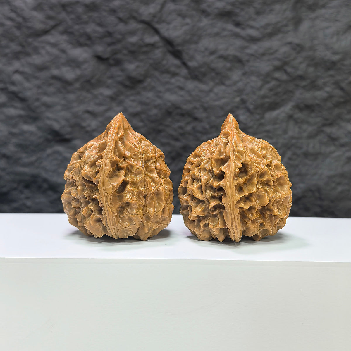 Official Wenwan Art hat-shaped walnut pair, classic Wenwan walnuts with detailed carvings, 44mm x 42mm, traditional craftsmanship.
