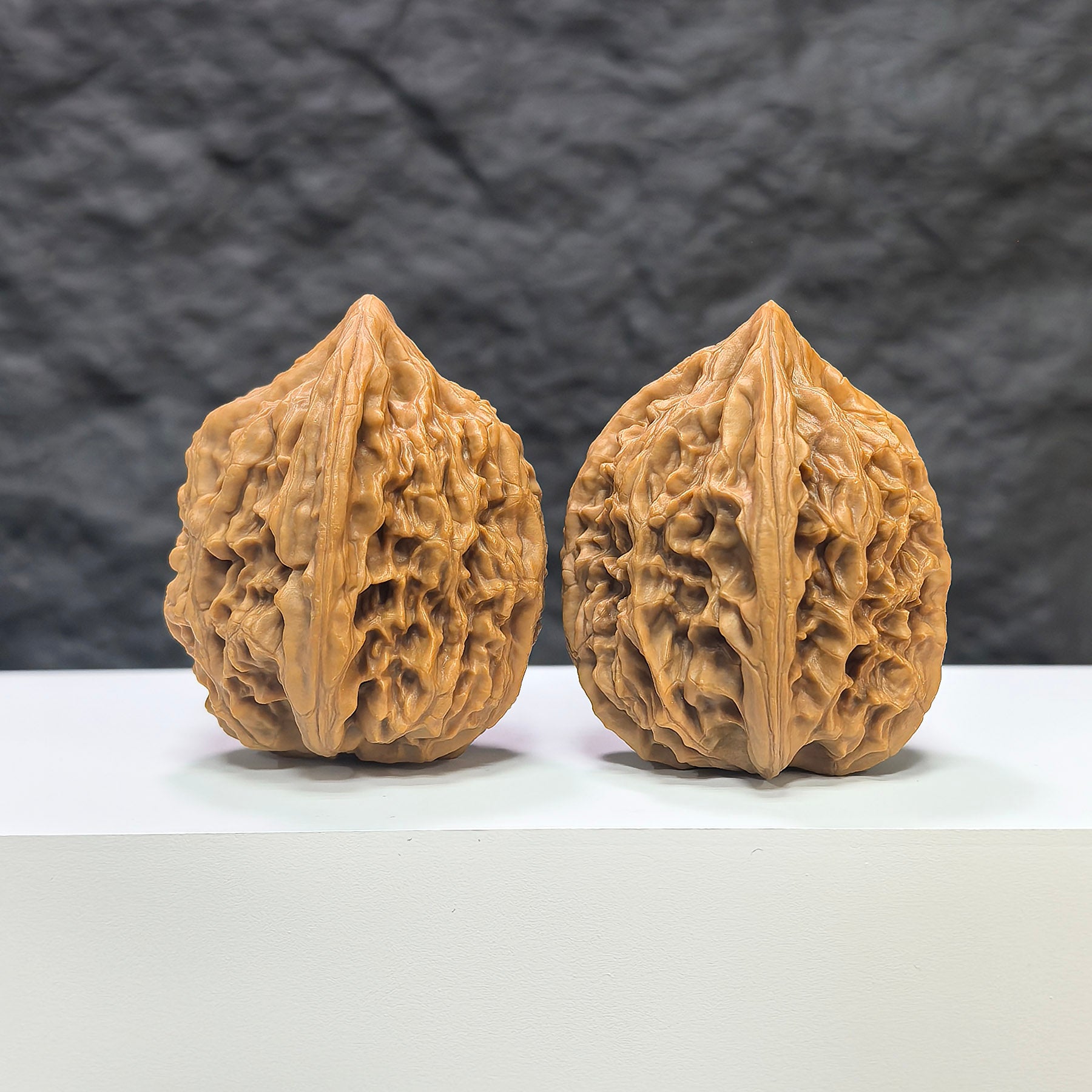 Pair of Beijing Chicken Heart Wenwan walnuts from Wenwan Art, 41mm, showcasing smooth, polished walnut carvings with intricate details.