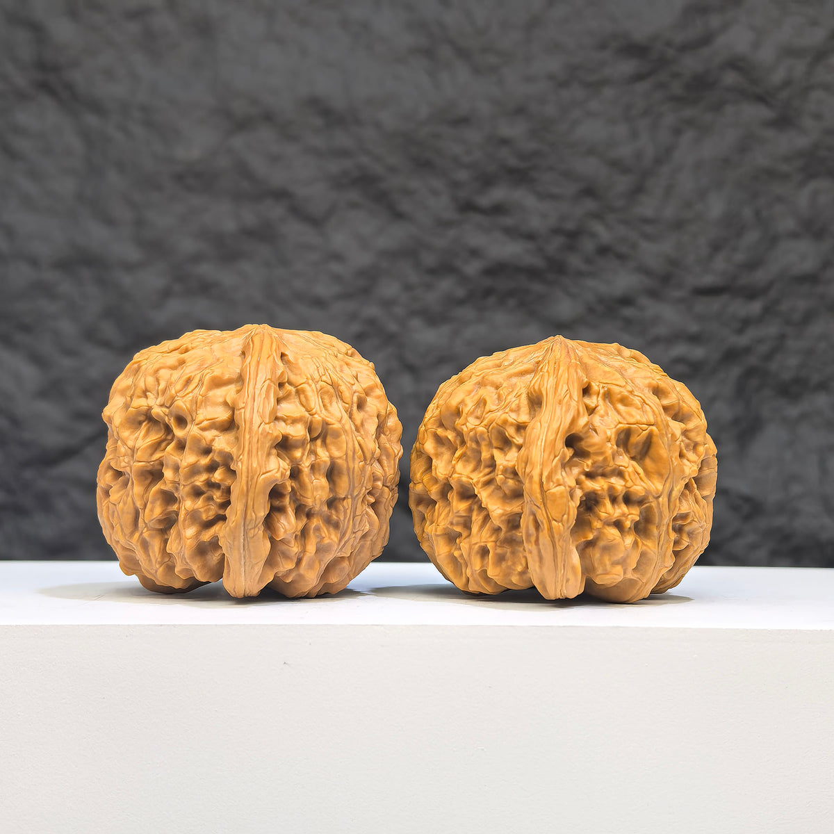 White Lion Wenwan Walnut pair by Wenwan Art, featuring 36mm x 39mm classic white lion carved walnuts, detailed and polished surface.