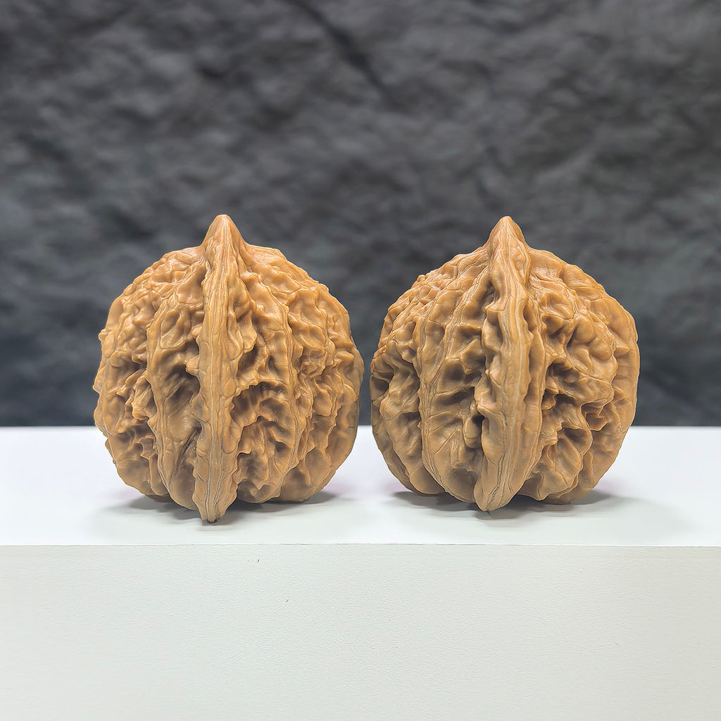 Pair of Xiayunling Peach Heart Concave Base Wenwan walnuts from Wenwan Art, showing detailed deep-base walnut with pinkish hue.