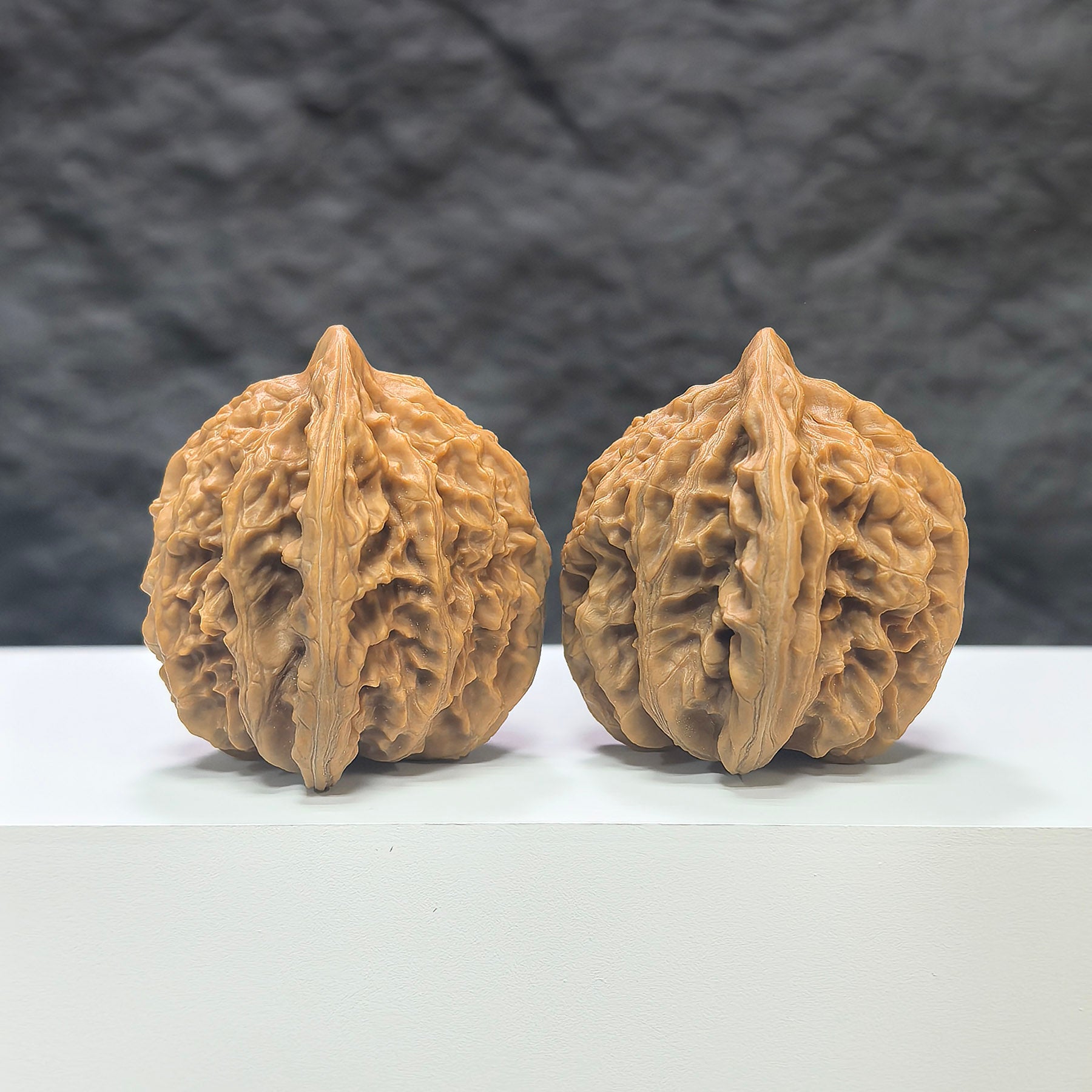 Pair of Xiayunling Peach Heart Concave Base Wenwan walnuts from Wenwan Art, showing detailed deep-base walnut with pinkish hue.