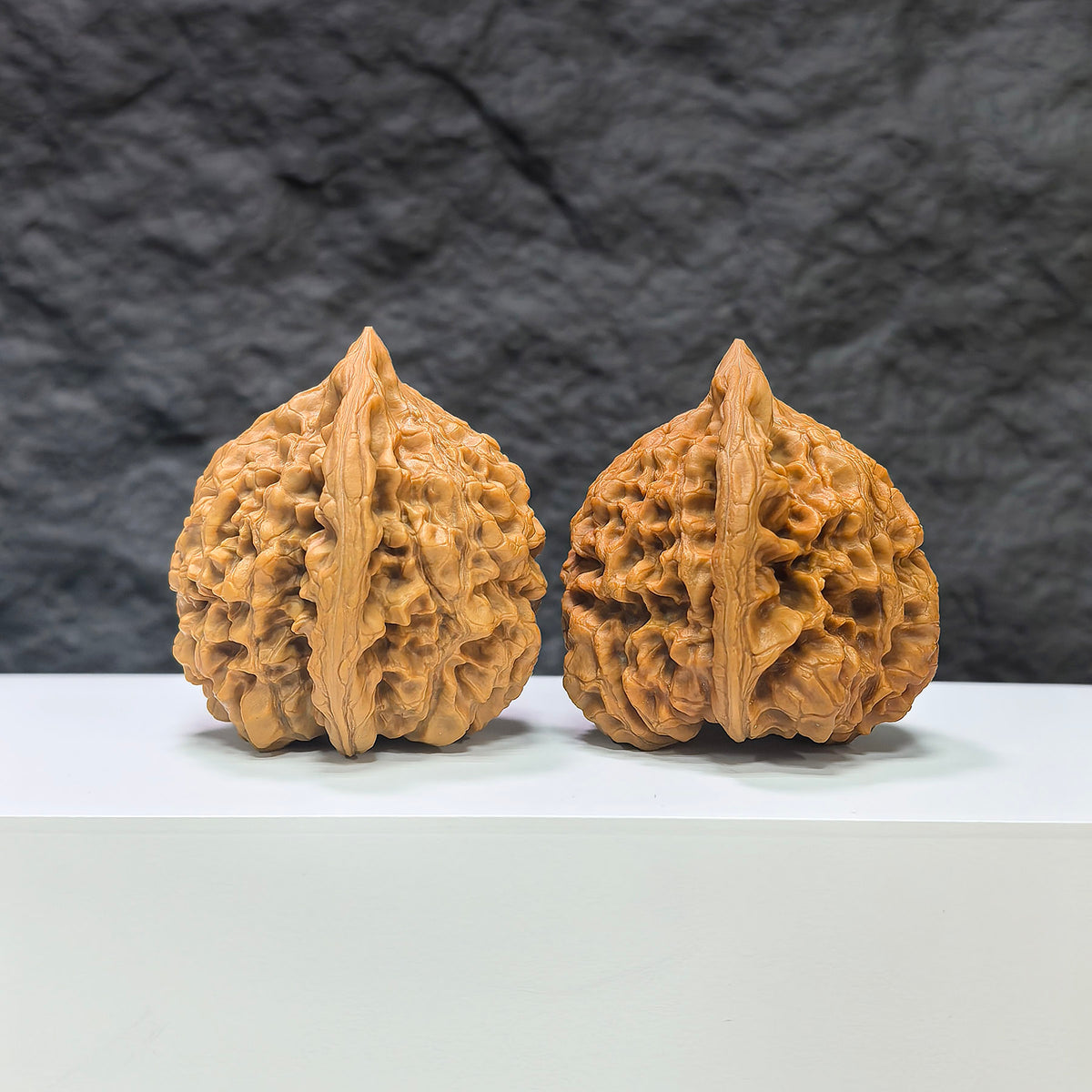 Pair of large Wenwan Art official Wenwan walnuts, 48mm x 45mm, showcasing smooth, polished walnut shells with detailed natural textures.