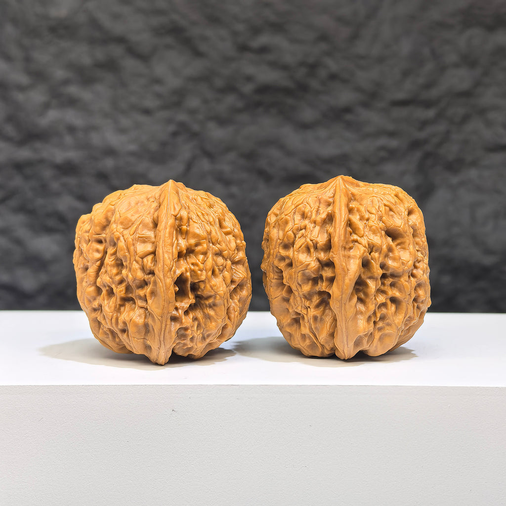Miniature Wenwan Walnut pair with Yuhua stone design, size 32mm, crafted by Wenwan Art, showing detailed natural patterns.