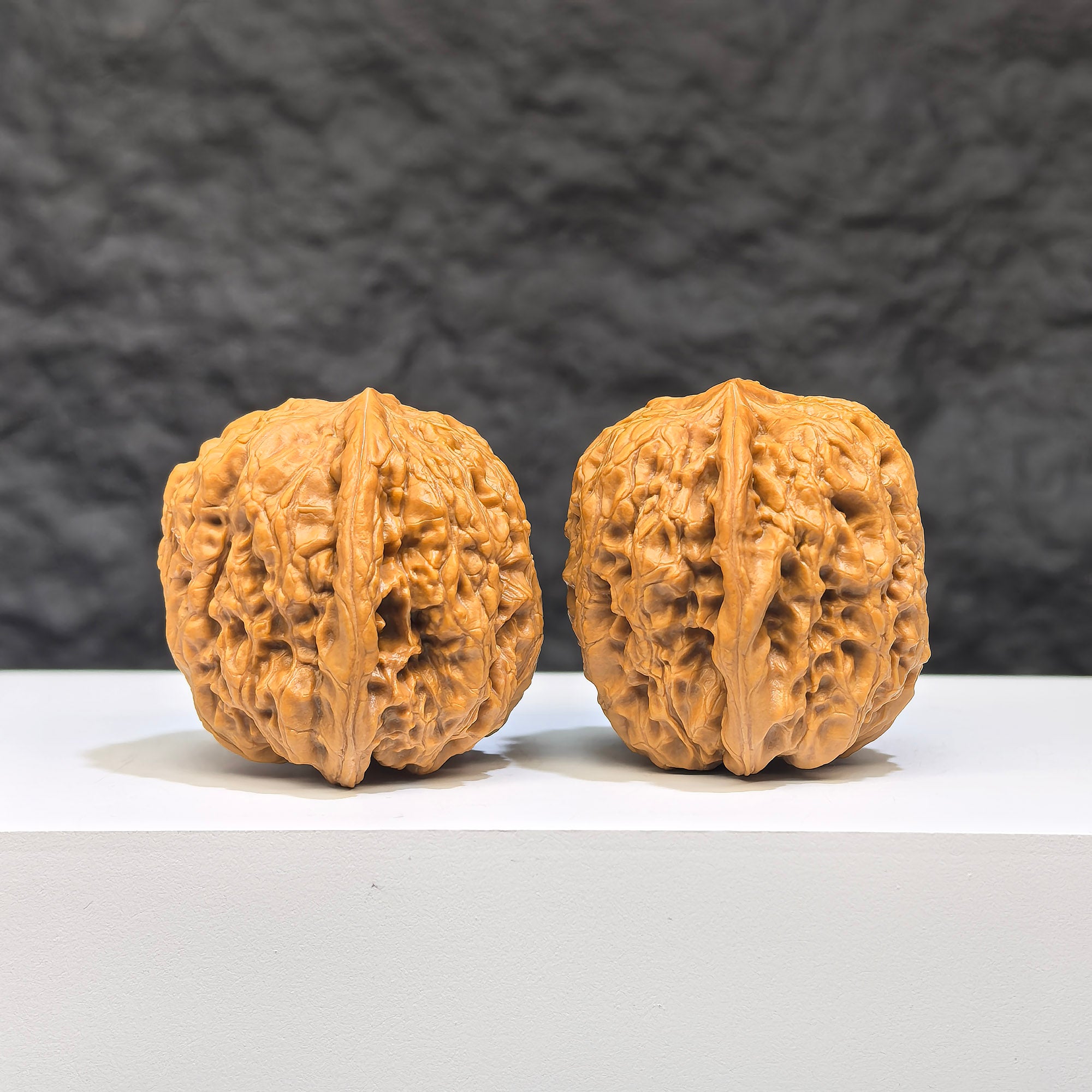 Miniature Wenwan Walnut pair with Yuhua stone design, size 32mm, crafted by Wenwan Art, showing detailed natural patterns.