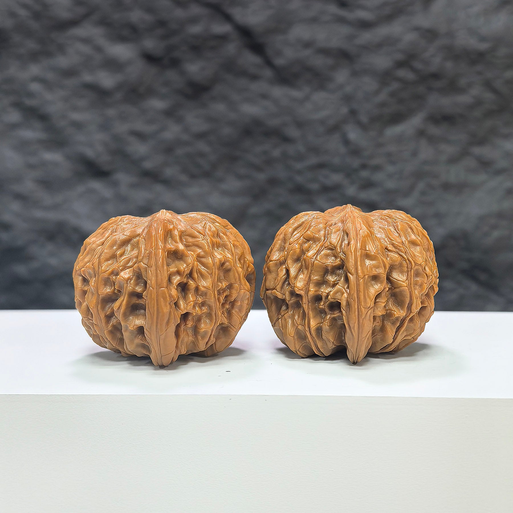 Pair of Classic Scholar Wenwan Walnuts by Wenwan Art, hand-matched, 41mm x 39mm, showcasing smooth, polished surface and natural wood grain.