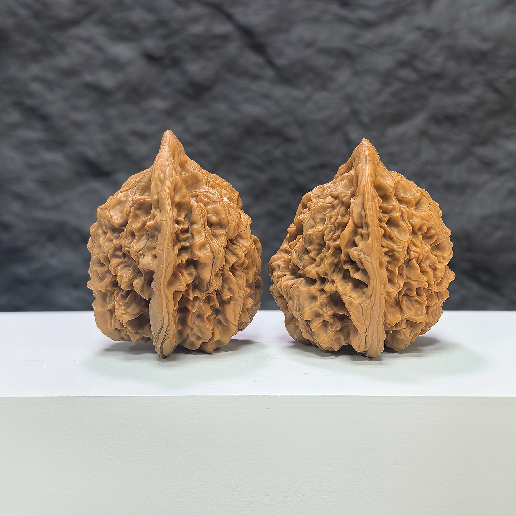 Wenwan Art official hat-shaped Wenwan walnut pair, 44mm x 40mm, with intricate carvings, displayed on a neutral background.