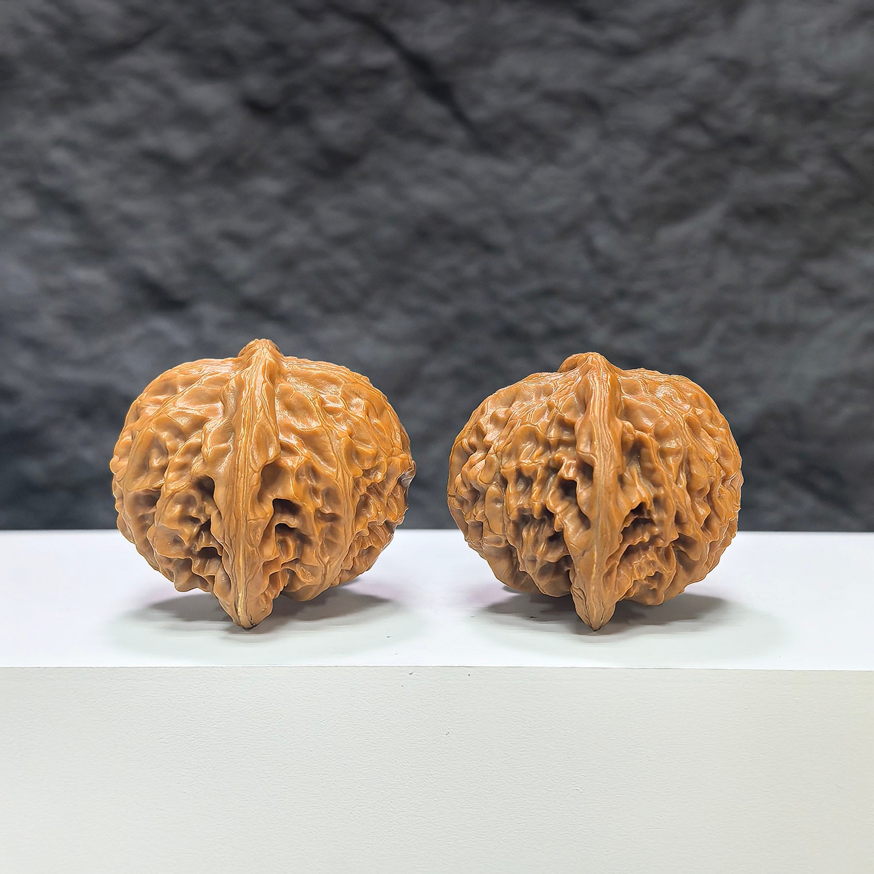 Pair of Classic Scholar Wenwan Walnuts by Wenwan Art, hand-matched with 43mm x 38mm size, showcasing detailed craftsmanship.