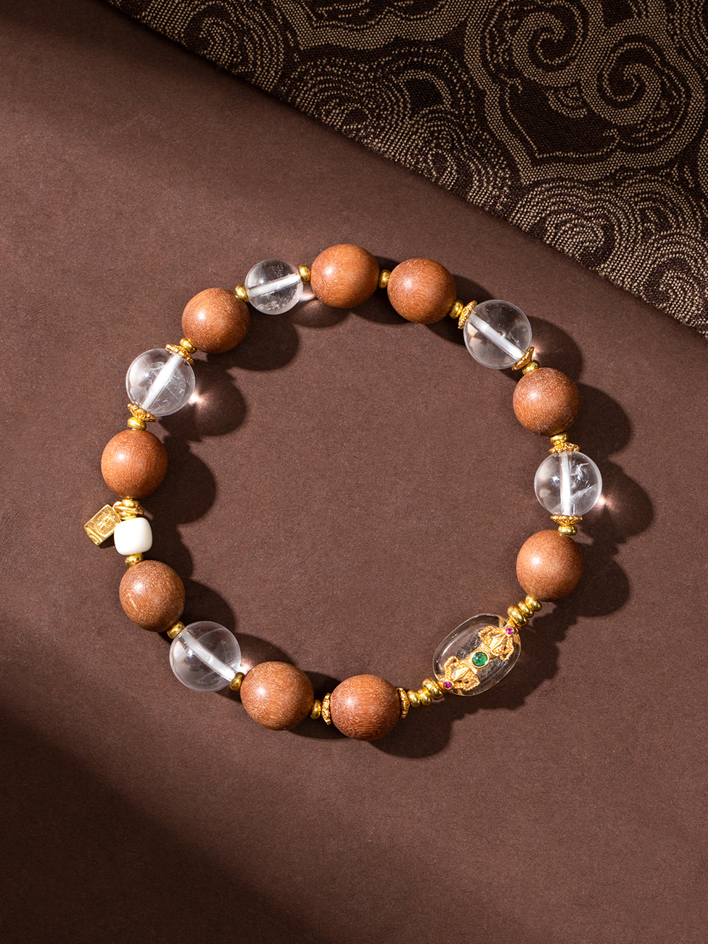 Beads bracelet featuring sandalwood and clear quartz vajra beads, 10mm, with natural wood and transparent quartz details.