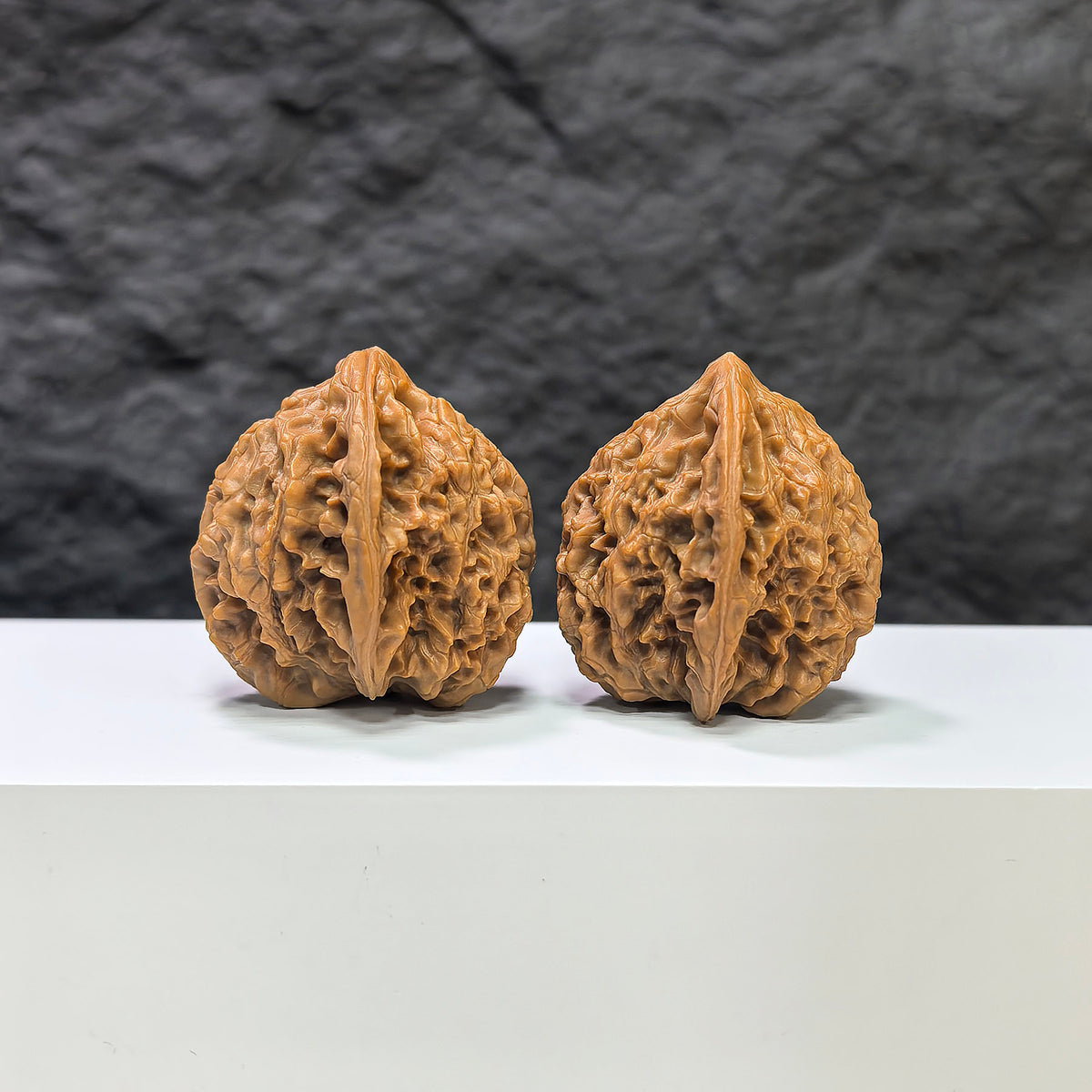 Golden Kylin Wenwan Walnut pair by Wenwan Art, 37mm x 37mm, showcasing detailed carvings and a rich golden color.