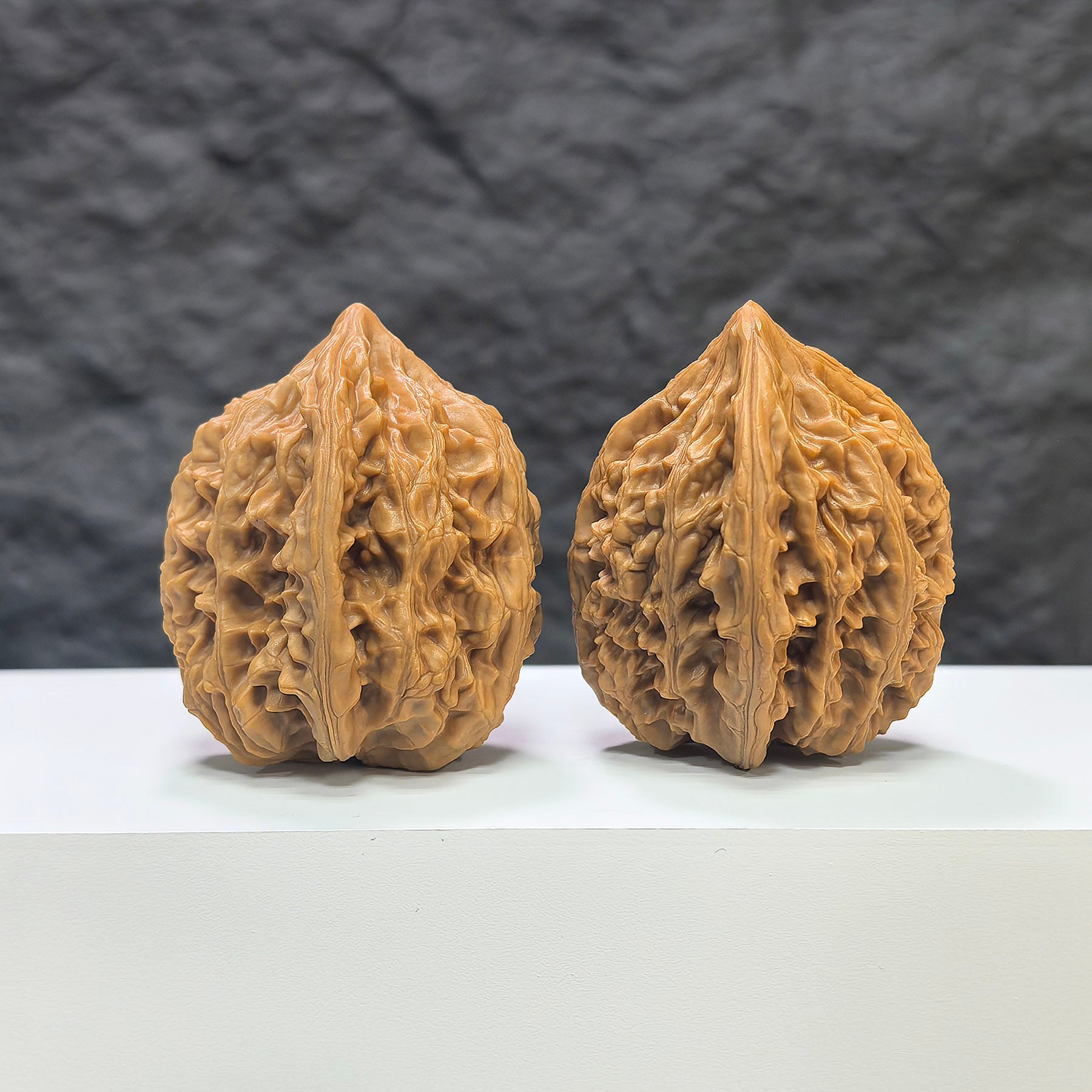 Pair of Beijing Chicken Heart Wenwan walnuts from Wenwan Art, 41mm, featuring smooth, rounded walnut shapes with intricate natural patterns.