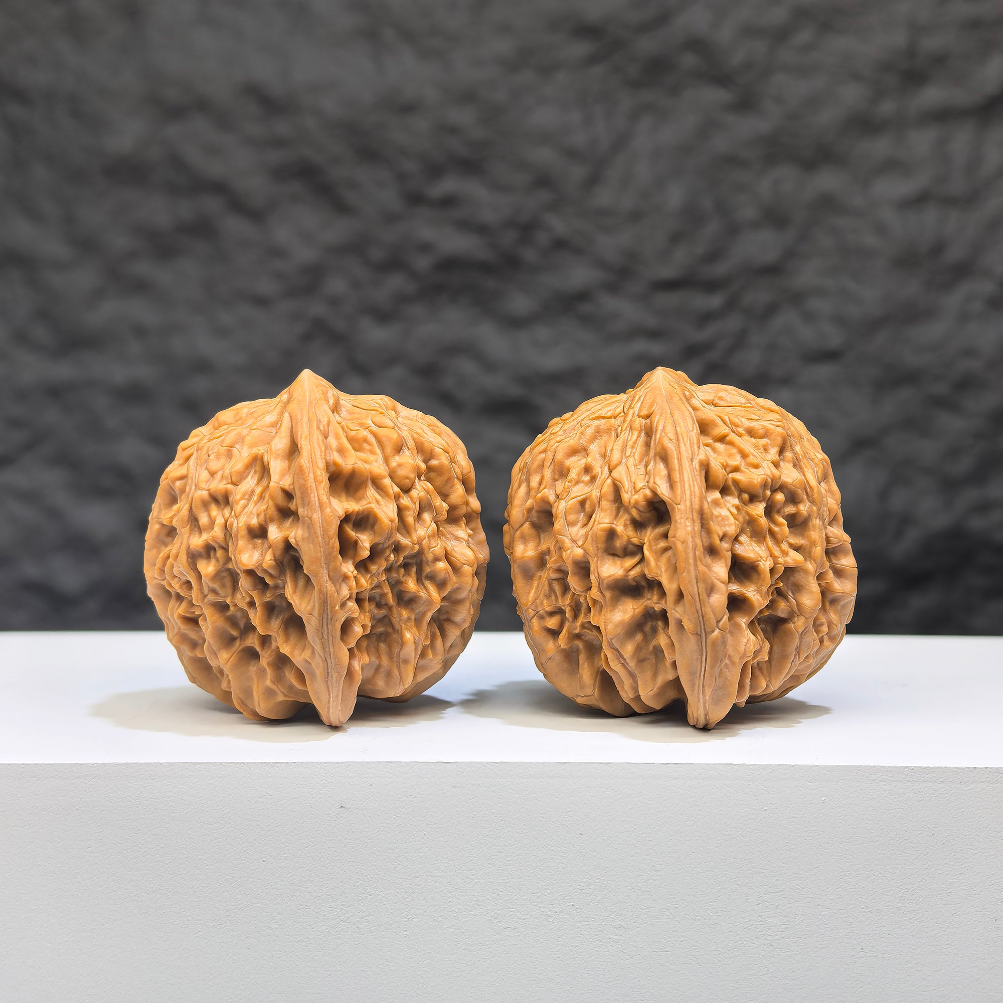 Pair of Wenwan Art Millstone Classic Wenwan walnuts, 38mm x 37mm, showing detailed carved patterns and smooth polished surfaces.