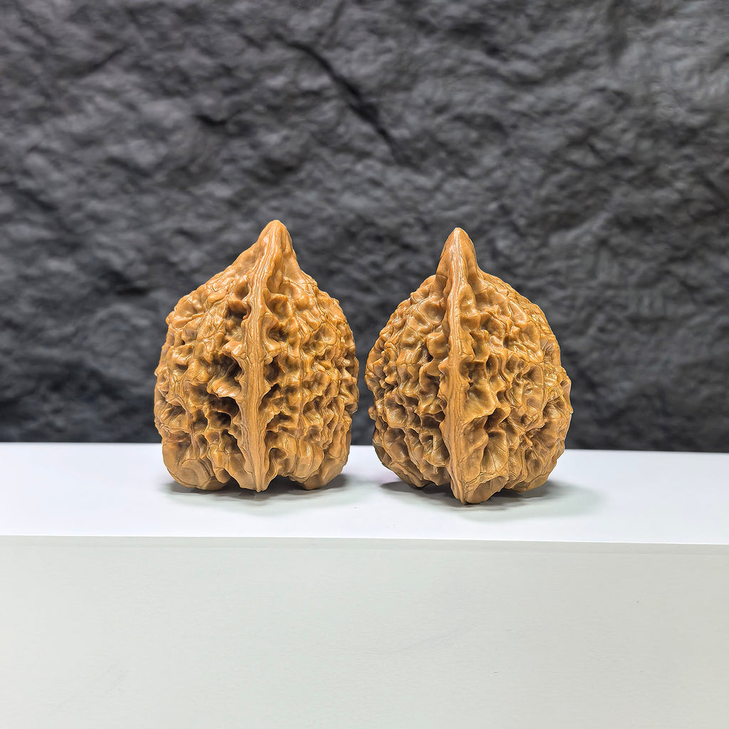 Pair of official Wenwan Art classic Wenwan walnuts, 43mm x 37mm, featuring natural walnut textures and detailed carving.