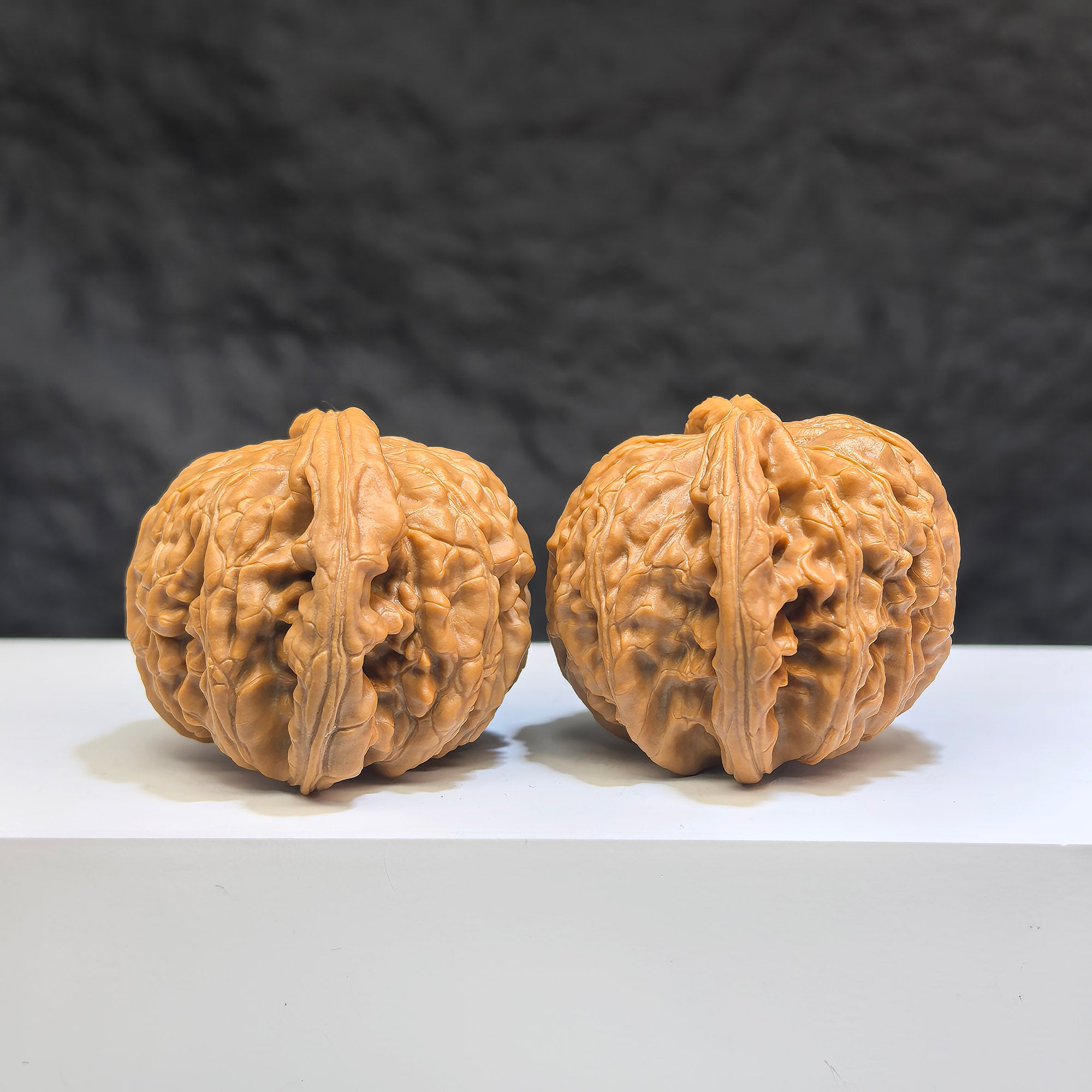 Pair of Low-pointed White Lion Wenwan walnuts by Wenwan Art, measuring 41mm x 38mm, with detailed carved white lion figures.