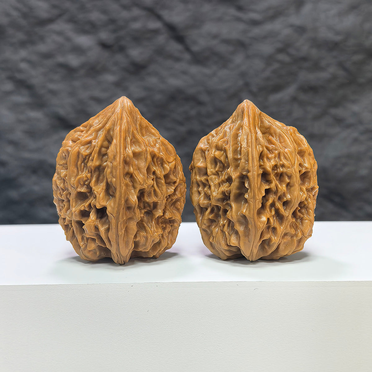 Pair of Beijing Chicken Heart Wenwan walnuts from Wenwan Art, 39mm size, showcasing natural walnut shape and rich wood grain.