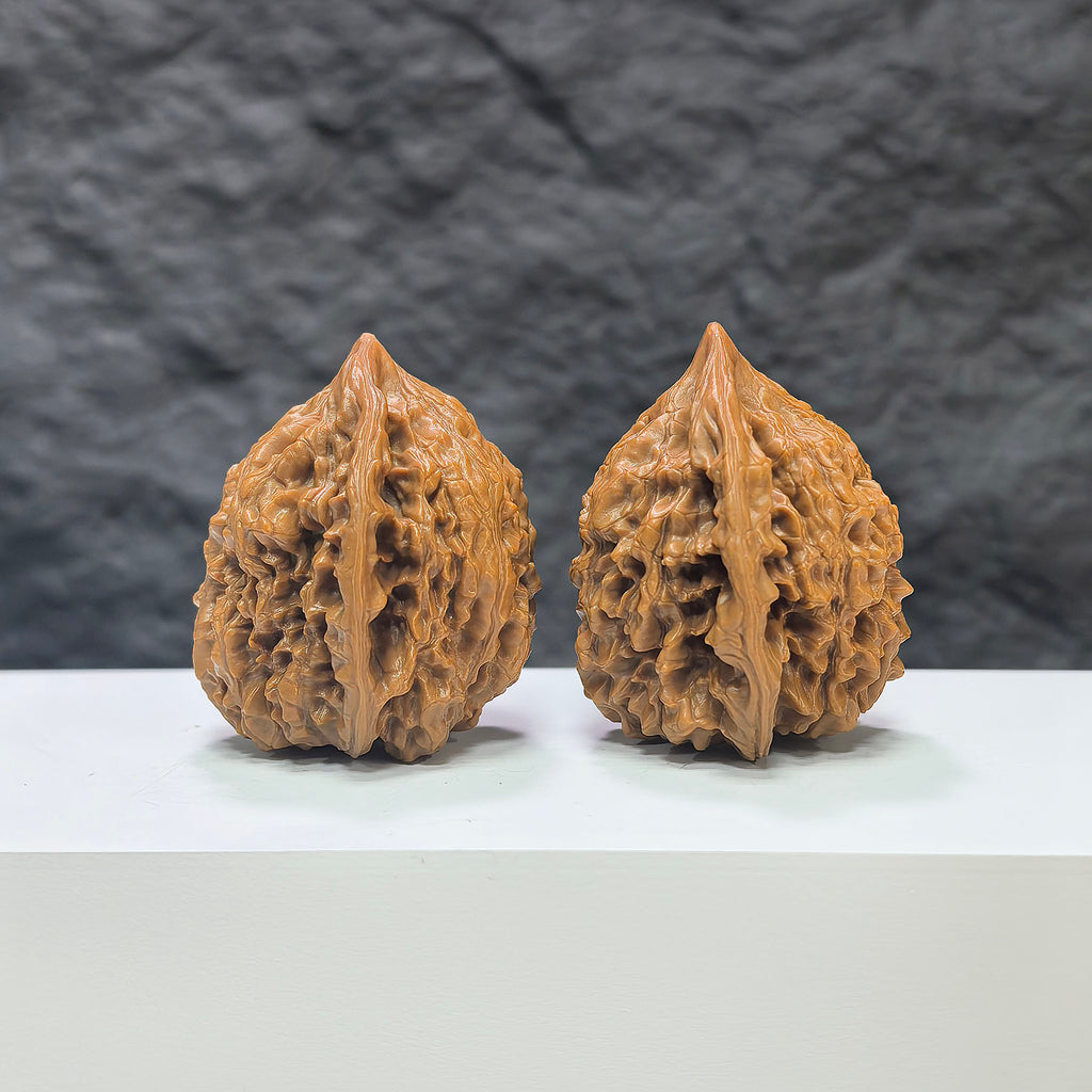 Pair of large Wenwan Art official Wenwan walnuts, 40mm x 36mm, featuring smooth, polished surfaces and natural wood grain details.