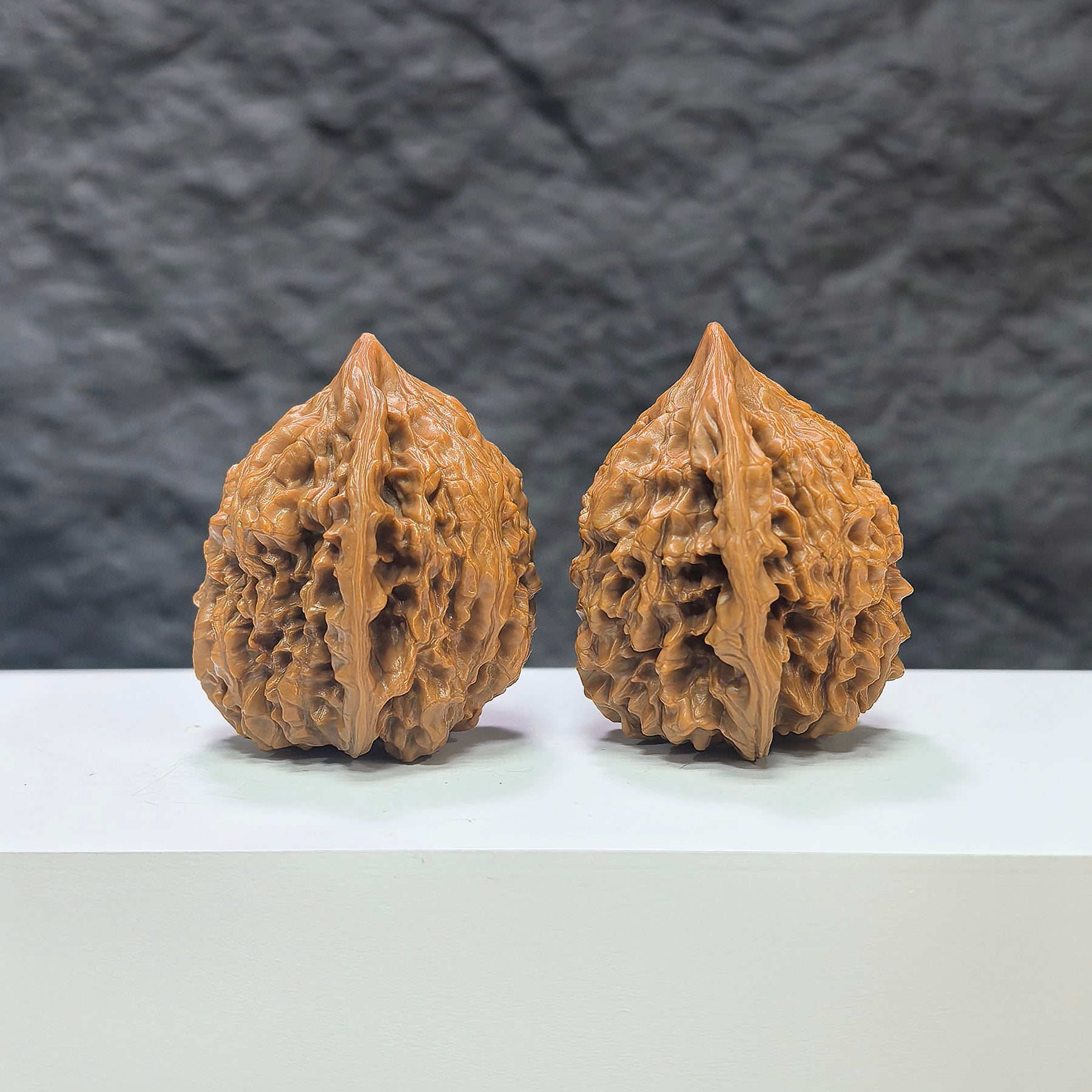 Pair of large Wenwan Art official Wenwan walnuts, 40mm x 36mm, featuring smooth, polished surfaces and natural wood grain details.
