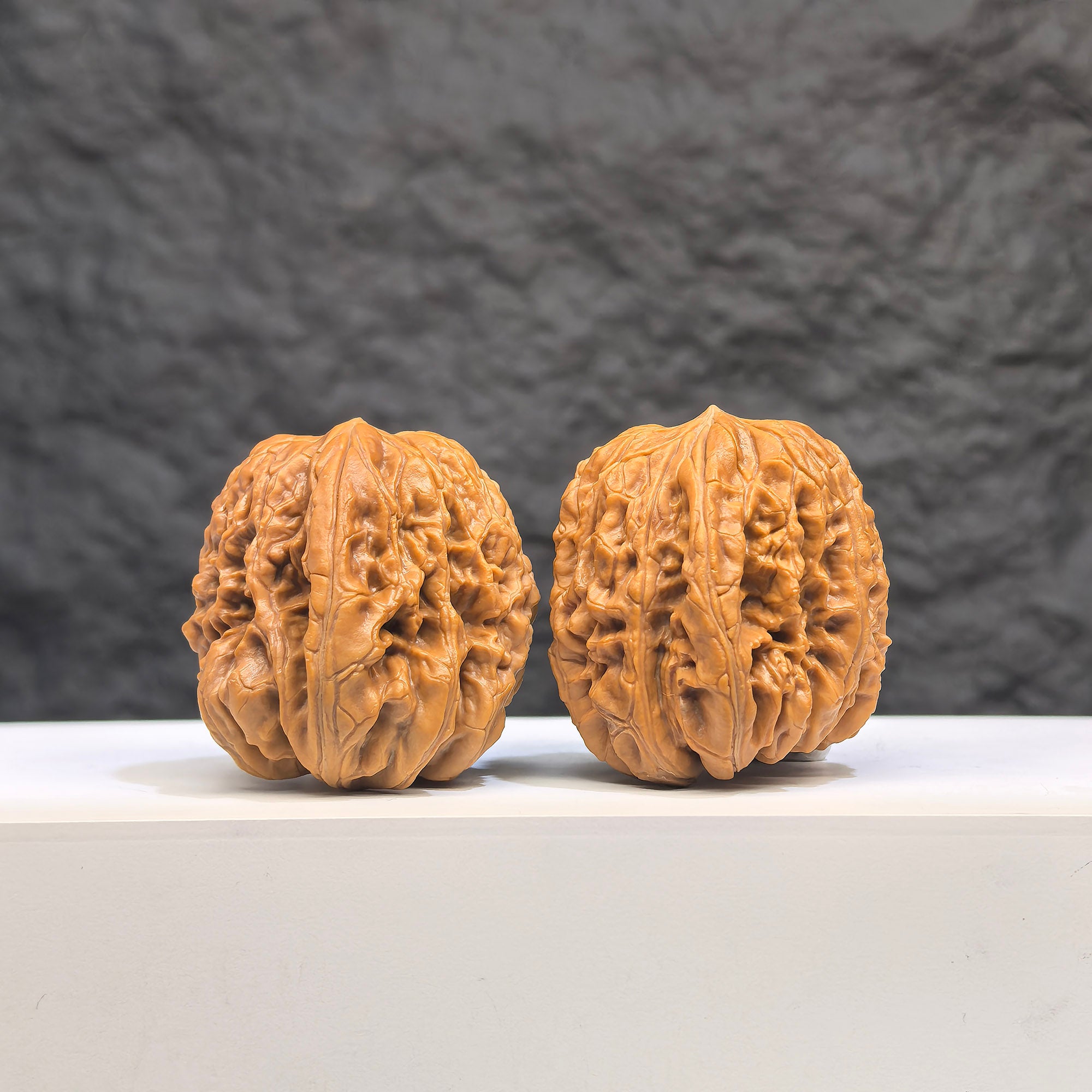 Selected grade Blizzard Wenwan Walnut, 3.4cm diameter, showing smooth surface and natural wood grain pattern.