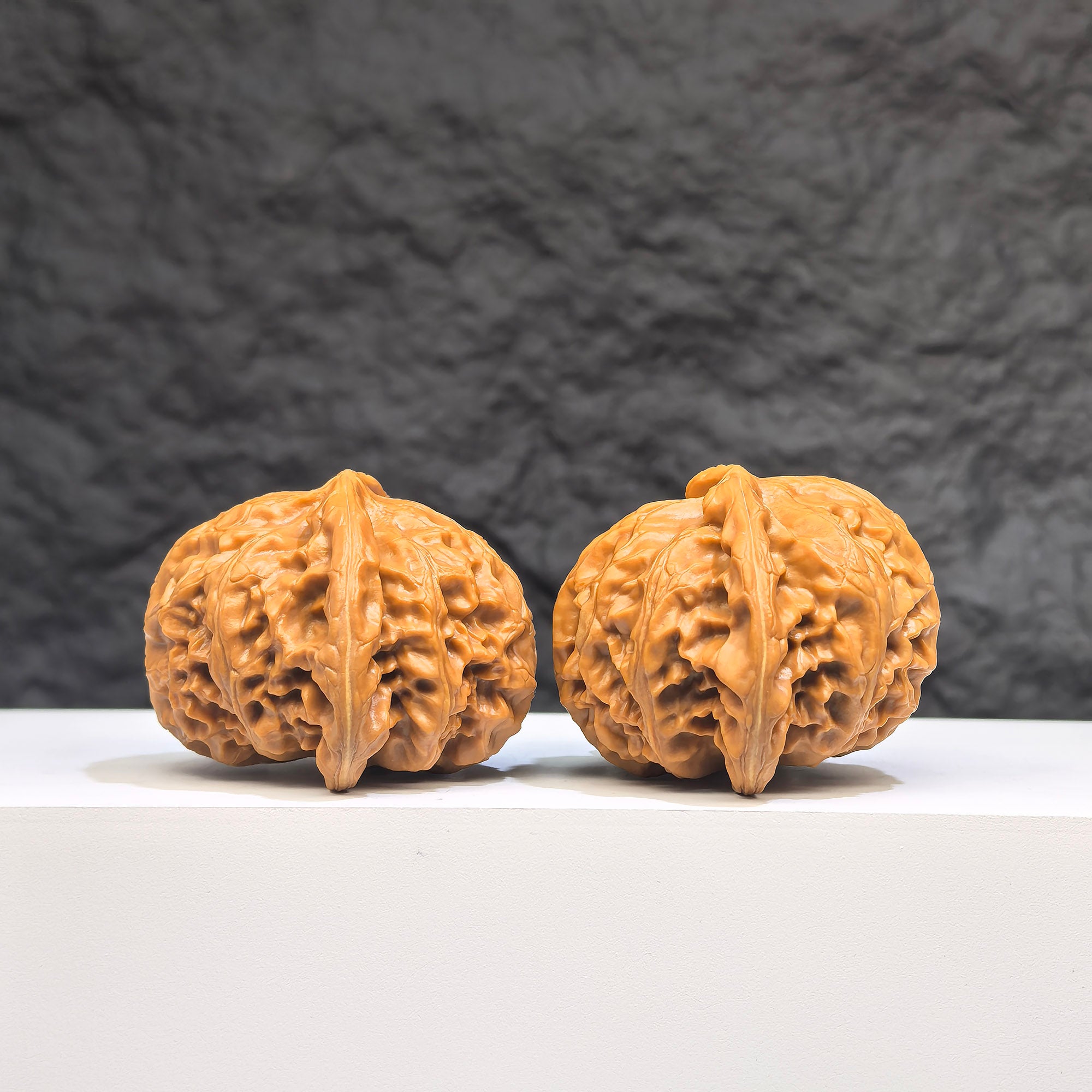 Pair of Palace Lantern Wenwan Walnuts by Wenwan Art, 42mm x 41mm, featuring intricate carved designs on smooth walnut surfaces.