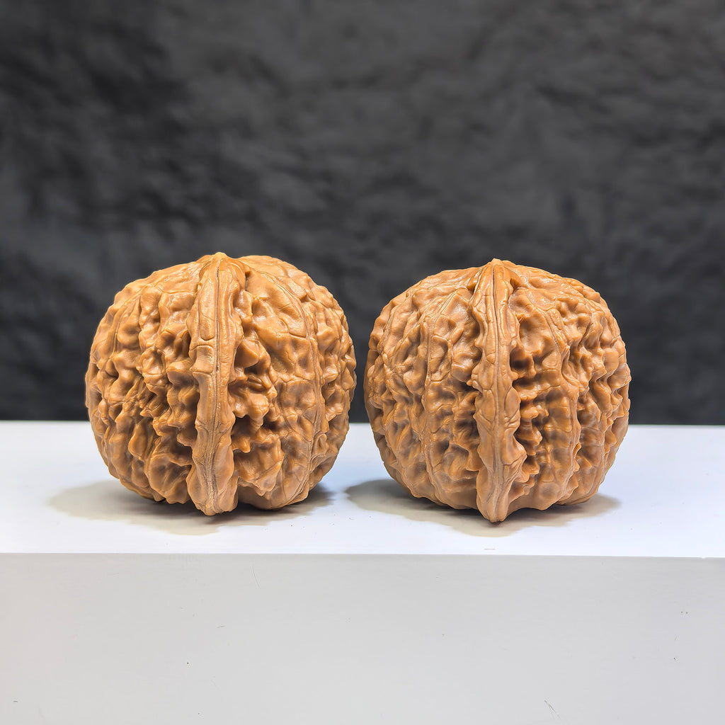 Pair of White Lion Wenwan Walnuts from Wenwan Art, featuring intricate carvings and 36mm size in a classic white lion design.