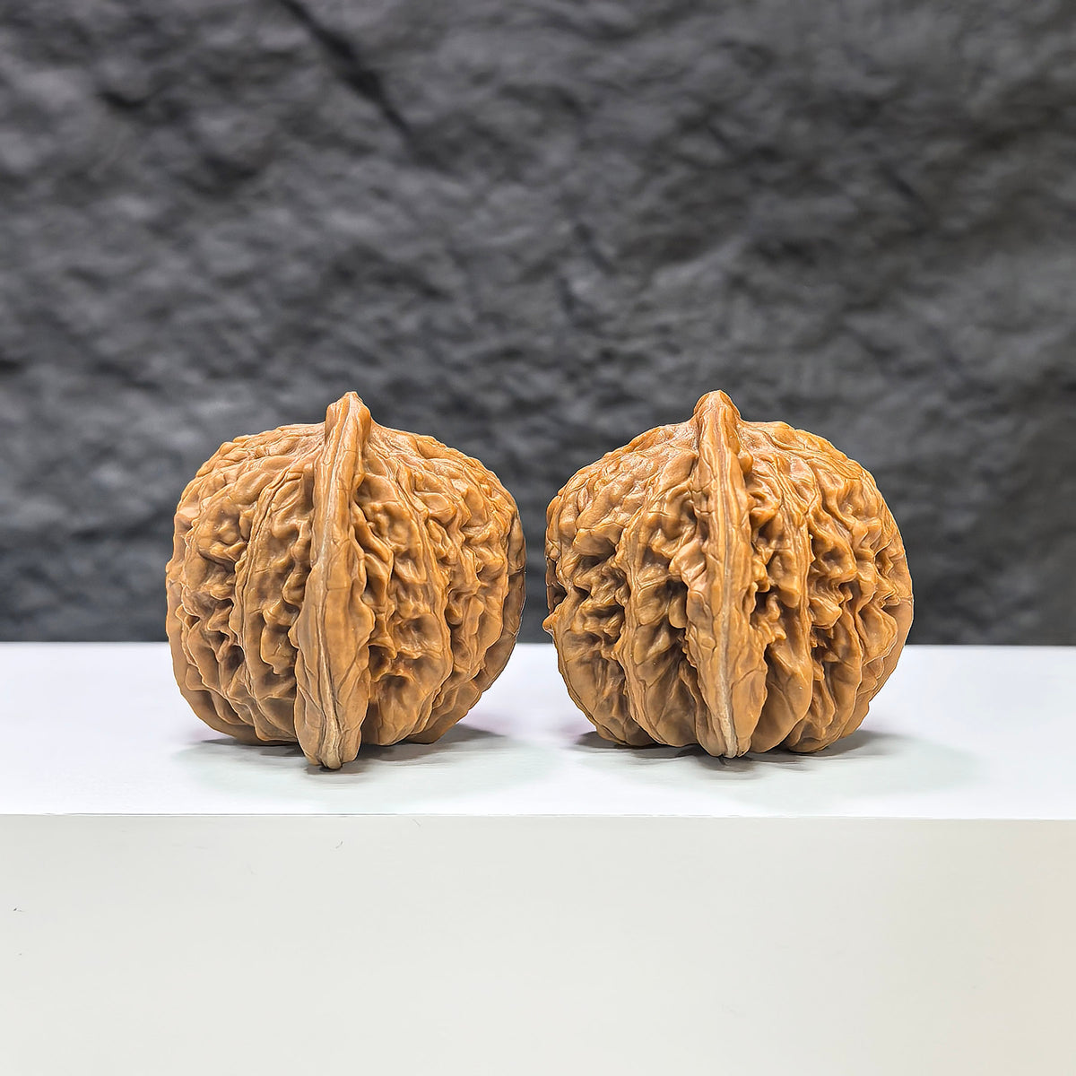 Pair of Sizuolou Wenwan Walnuts by Wenwan Art, 39mm x 37mm, featuring intricate carvings and natural walnut texture.