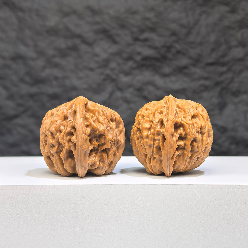 Miniature Wenwan Walnut pair with symmetrical millstone design from Wenwan Art, measuring 36mm x 33mm, showcasing detailed craftsmanship.