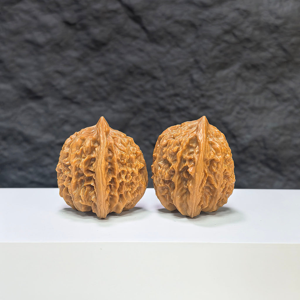 Pair of Xiayunling Classic Wenwan Walnuts from Wenwan Art, 36mm, showing detailed carved walnut surfaces and natural wood textures.